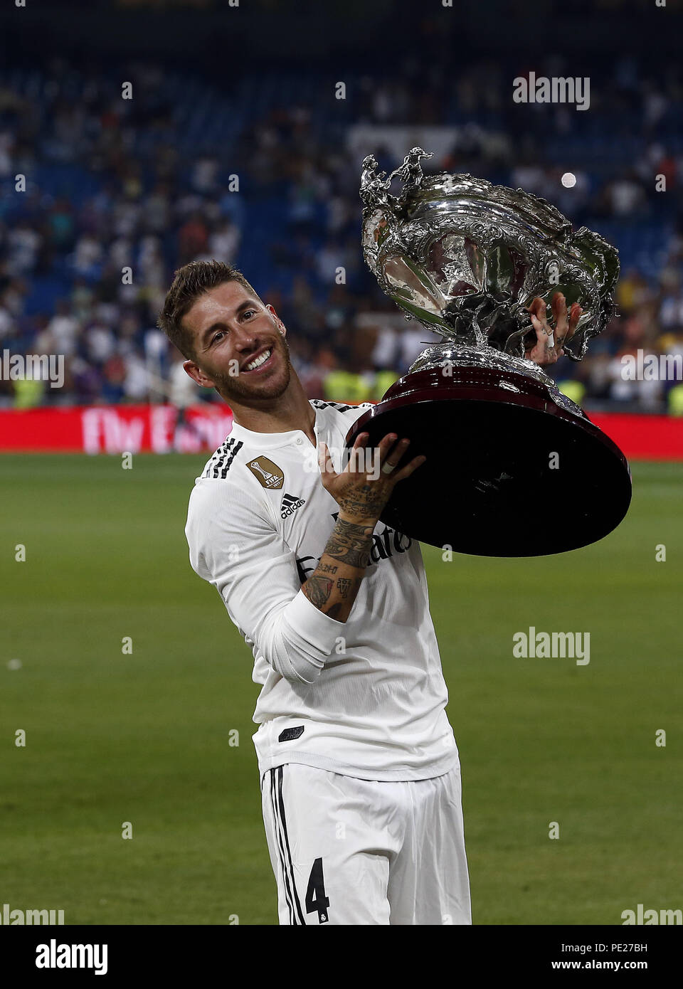 Madrid, Madrid, Spain. 11th Aug, 2018. Captain of Real Madrid Sergio Ramos stand the Santiago Bernabéu Trophy after winning the friendly match between Real Madrid CF and AC Milan at Estadio Santiago Bernabeu. Credit: Manu Reino/SOPA Images/ZUMA Wire/Alamy Live News Stock Photo