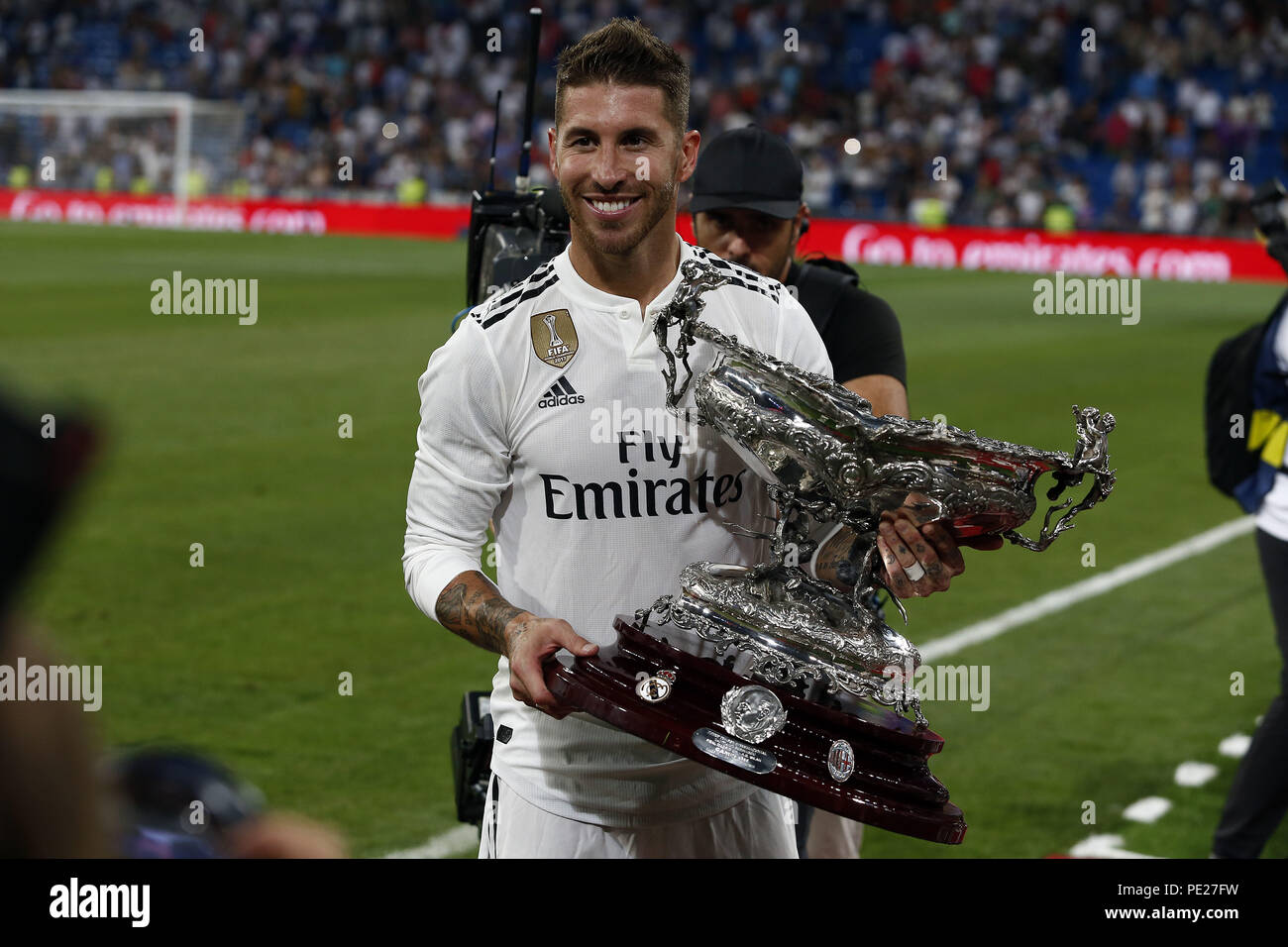 Madrid, Madrid, Spain. 11th Aug, 2018. Captain of Real Madrid Sergio Ramos stand the Santiago Bernabéu Trophy after winning the friendly match between Real Madrid CF and AC Milan at Estadio Santiago Bernabeu. Credit: Manu Reino/SOPA Images/ZUMA Wire/Alamy Live News Stock Photo