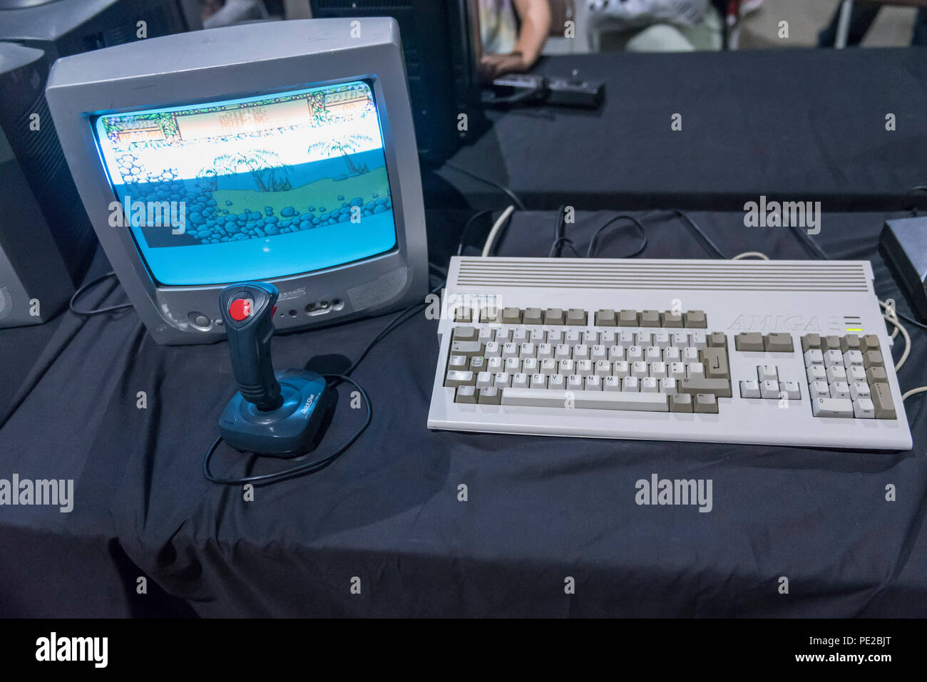 London, UK. 12 August 2018. A Commodore Amiga computer console at retro  games festival PLAY Expo held in London for the first time at Printworks,  Canada Water. Game enthusiasts visited to rediscover