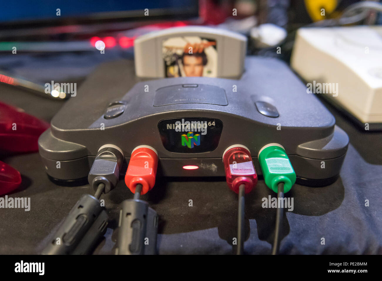 London, UK. 12 August 2018. A Nintendo 64 console at retro games festival  PLAY Expo held in London for the first time at Printworks, Canada Water.  Game enthusiasts visited to rediscover the
