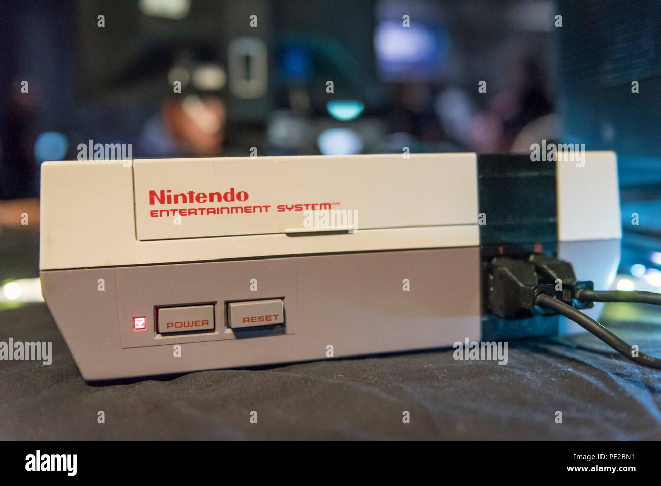 London, UK.  12 August 2018. A Nintendo Entertainment System console at retro games festival PLAY Expo held in London for the first time at Printworks, Canada Water. Game enthusiasts visited to rediscover the classics, from Donkey Kong, Pong, Super Mario Bros. and Space Invaders to vintage pinball machines, VR, indie games and a dedicated Minecraft zone. The show also included a sneak preview of new retro gaming streaming service, Antstream.  Credit: Stephen Chung / Alamy Live News Stock Photo