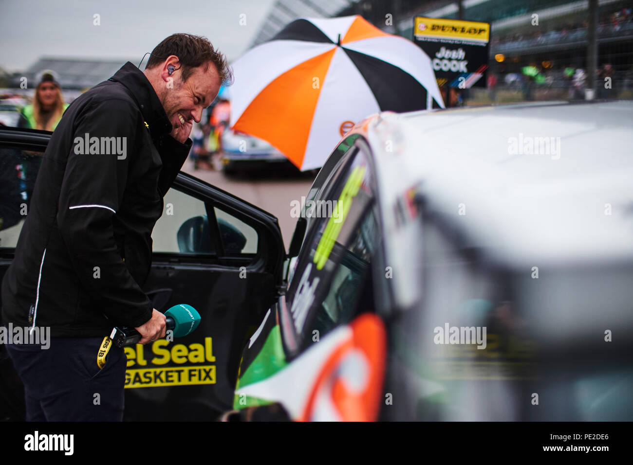 Corby, Northamptonshire, UK, 12th August 2018. ex BTCC racing driver and  ITV Sport presenter Paul O'Neill during the Dunlop MSA British Touring Car  Championship at Rockingham Motor Speedway. Photo by Gergo Toth /