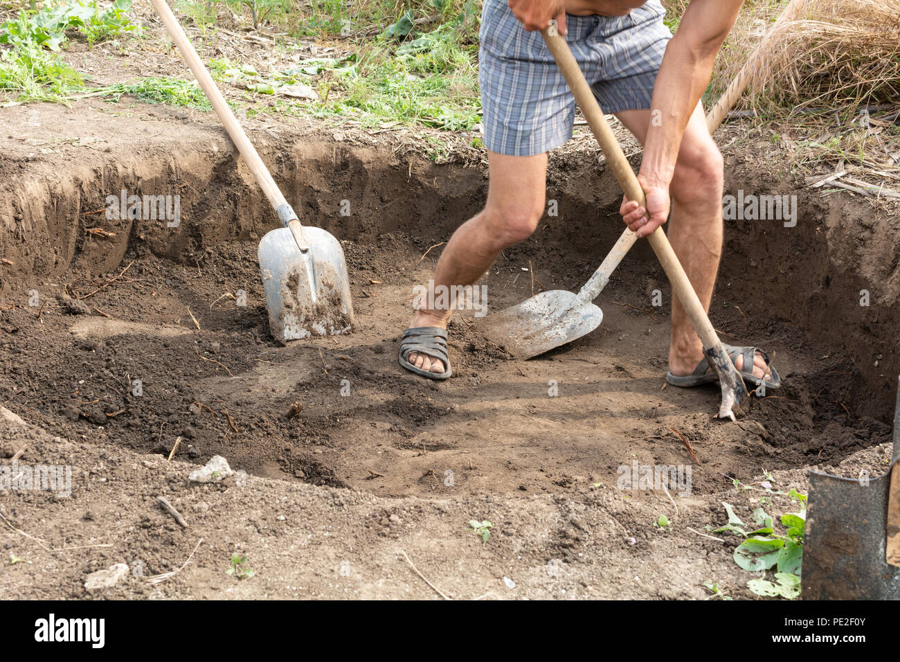 Workers dig a pit for a septic tank in a private house Stock Photo Alamy