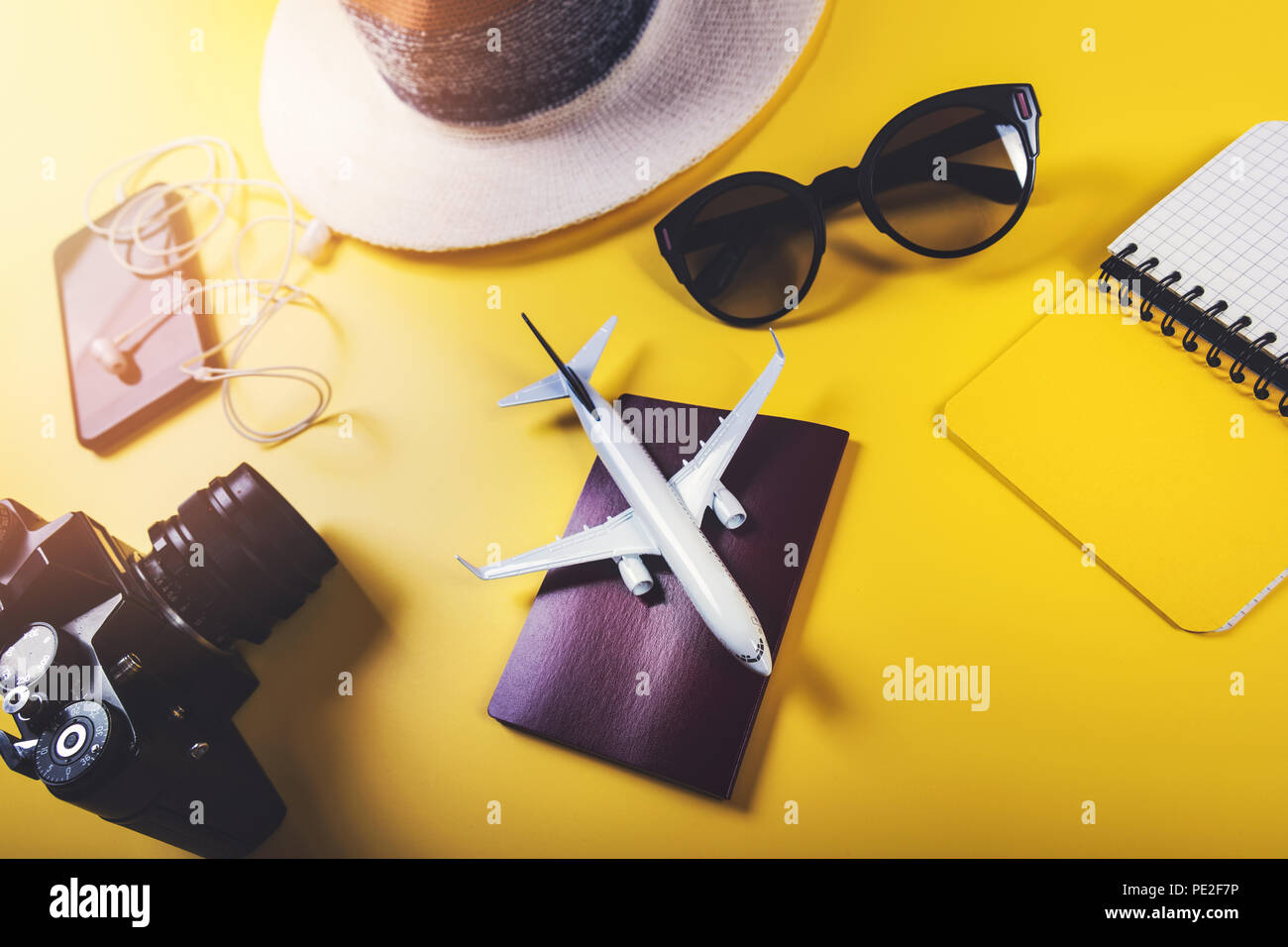 time to travel. traveler accessories on yellow background Stock Photo