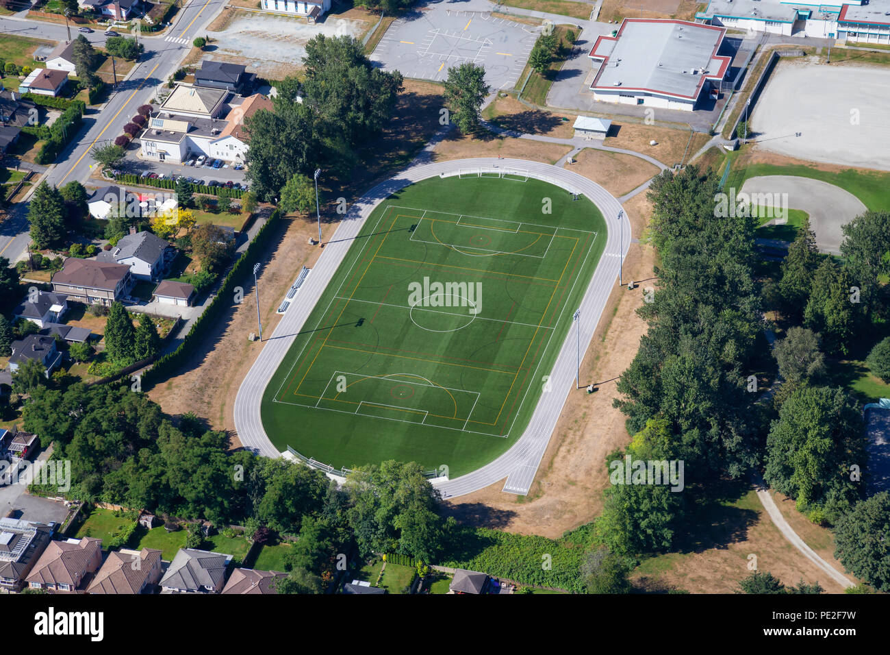 Aerial view of a green soccer field in an Elementary School. Taken in