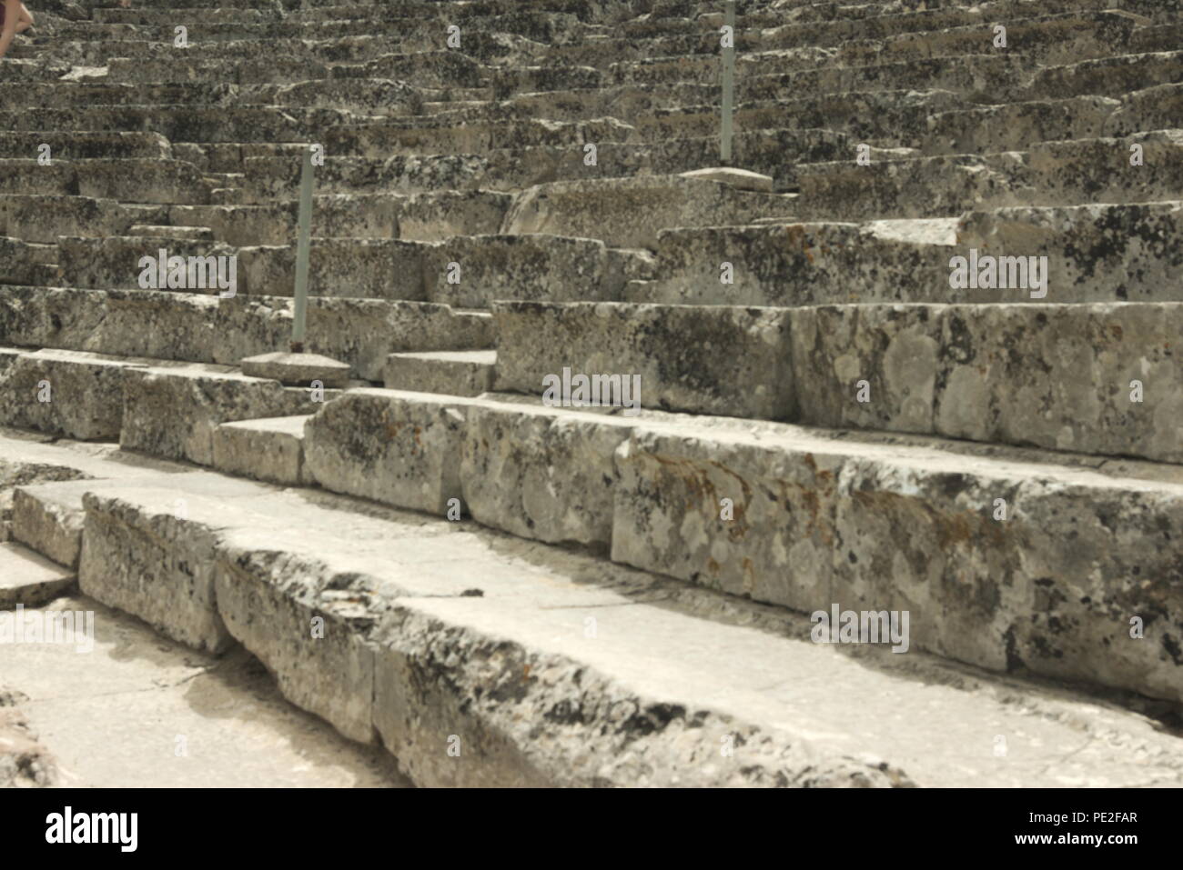 Greece, the ancient theater at Epidavros. Perfectly prserved and with perfect acoustics.  From the back row you can hear a pin drop on the stage below Stock Photo