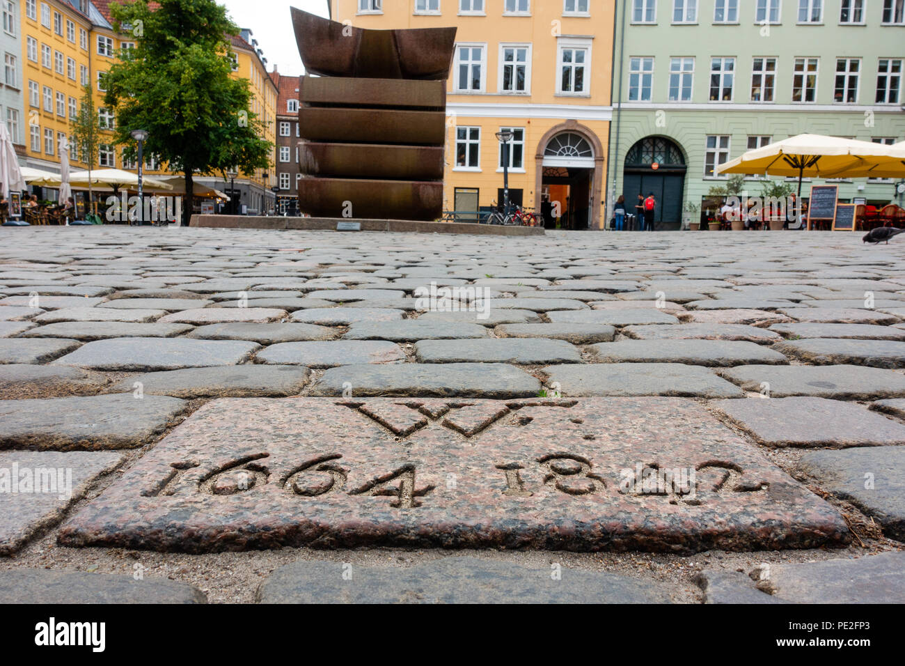 Stone in the pavement where the pillory over Danish traitor Corfitz Ulfeldt was erected on Gråbrødretorv, with the inscription 'WF 1664-1842' Stock Photo