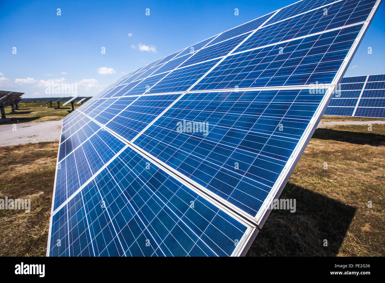 Solar power plants, photovoltaic panels arranged in a variety of scenes. Side view. Stock Photo