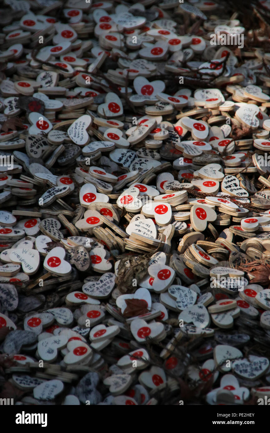 Small wooden heart plaques (Ema) with prayers and wishes at the Shinto Haruyama shrine (日光連山 遥拝所) in Nikko, Stock Photo
