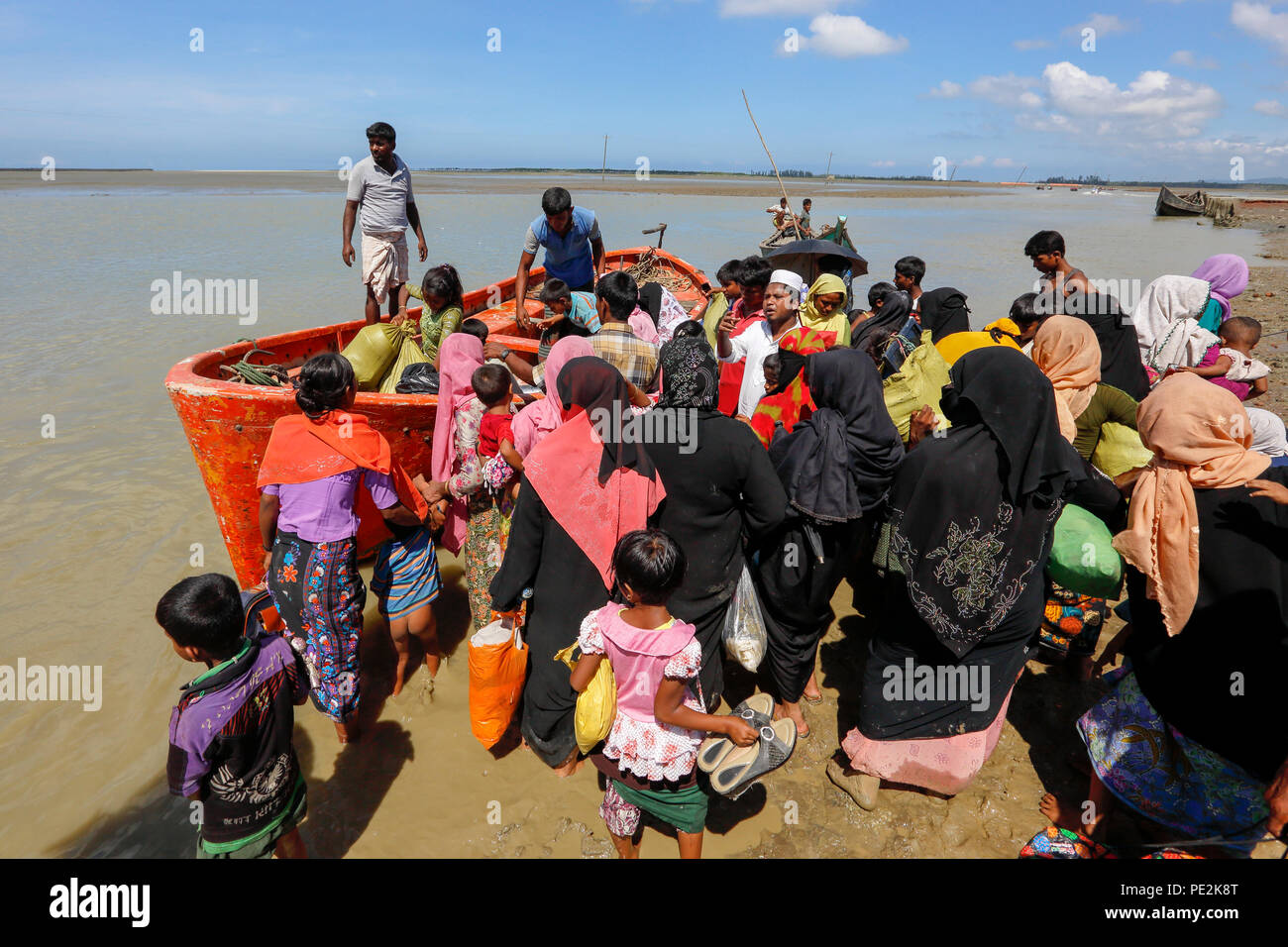 Rohingya refugees arrived at Shah Porir Dweep from Myanmar crossing the Naf River by boat. Teknaf, Cox's Bazar, Bangladesh. Stock Photo