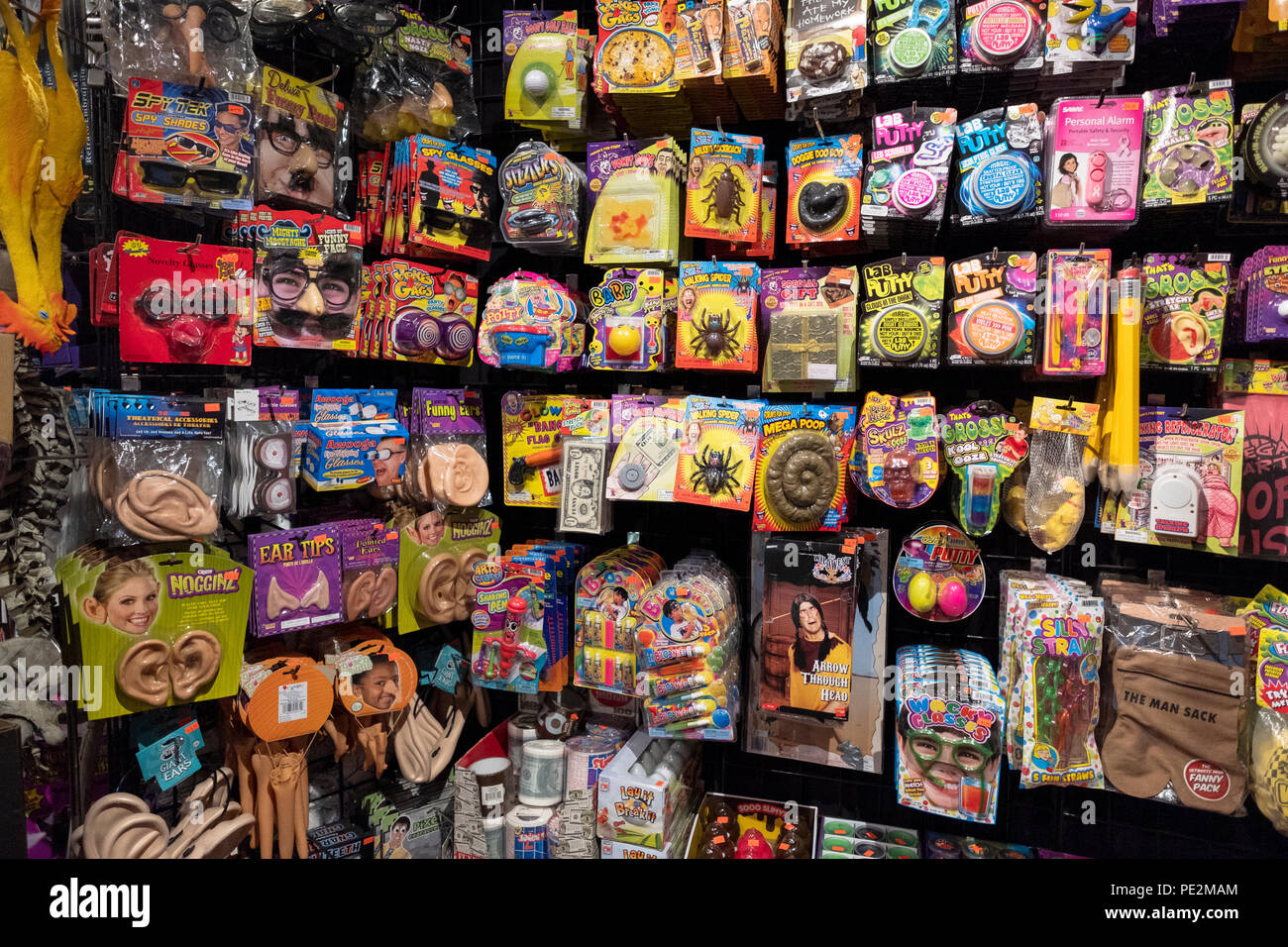 A collection of gag gifts, disguises and children's toys for sale at The Halloween Adventure in Greenwich Village in Manhattan, New York City. Stock Photo