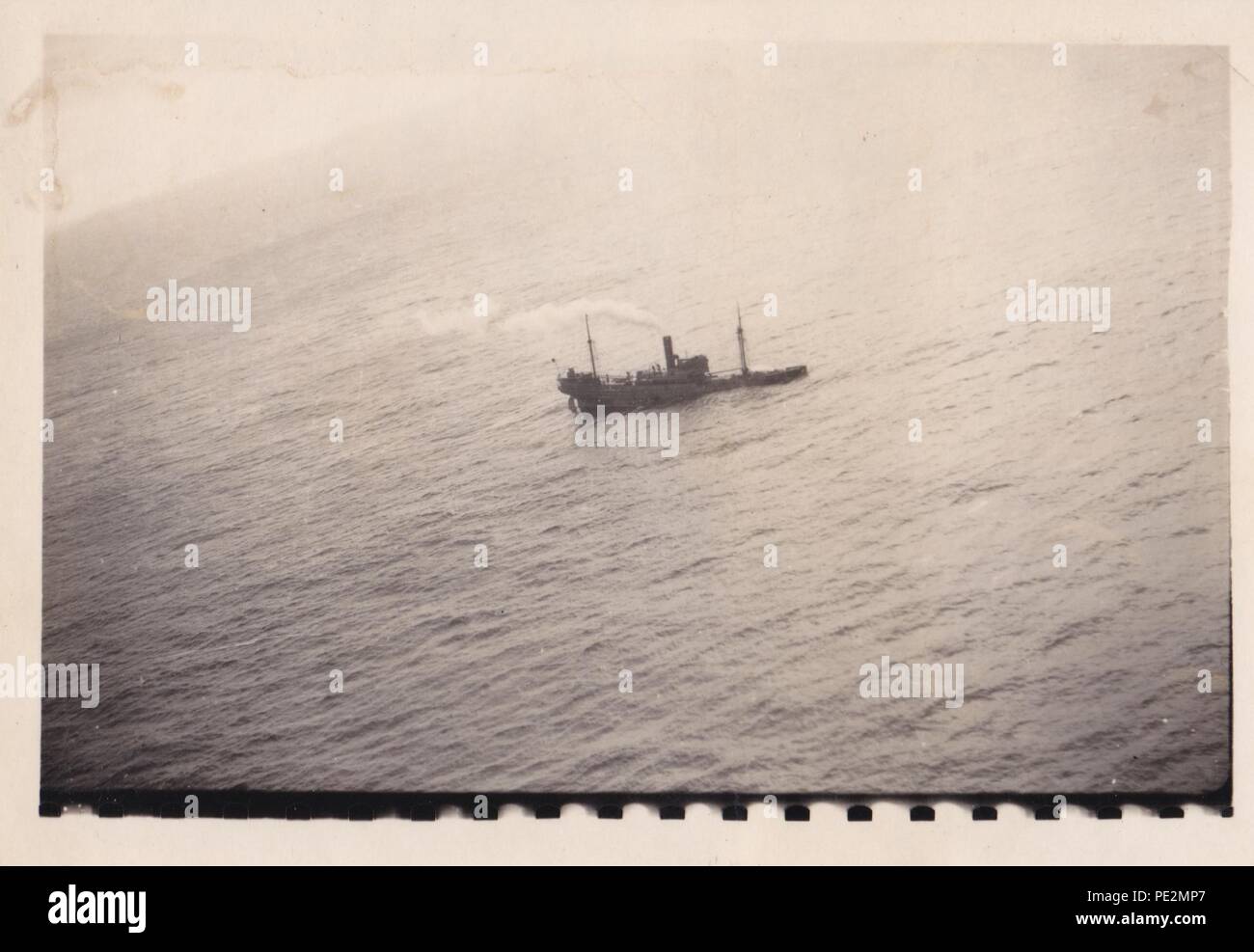 Image from the photo album of Oberfeldwebel Karl Gendner of 1. Staffel, Kampfgeschwader 40: Aerial photograph taken from a Focke Wulf FW 200 Condor of KG 40, showing a ship sinking in the Atlantic. This is probably MV Mamura, sunk by Leutnant Mayr and his crew on 19th March 1941. Stock Photo