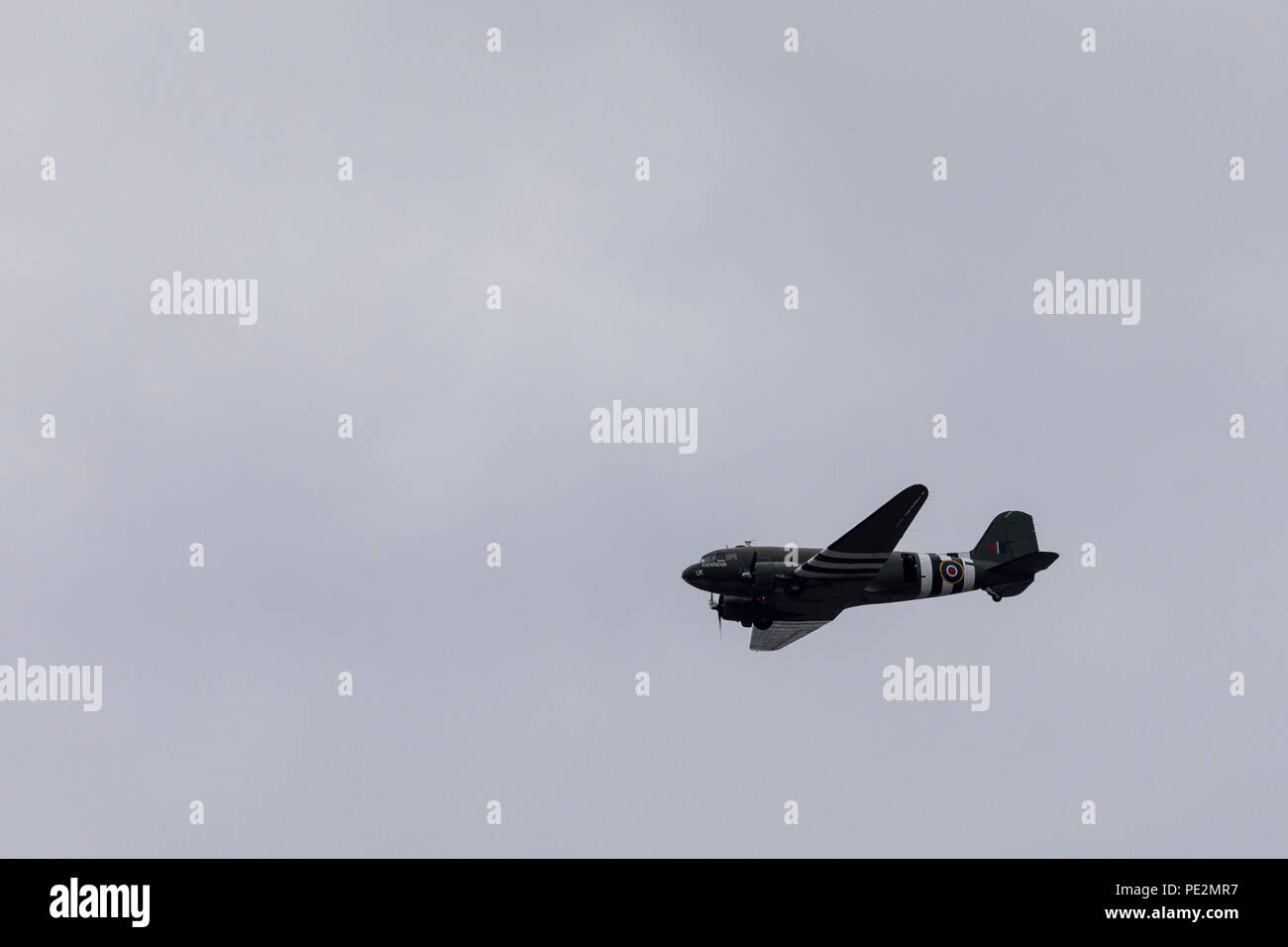 A Douglas C-47 Skytrain aircraft flying overhead for the RAF100 Anniversary Stock Photo