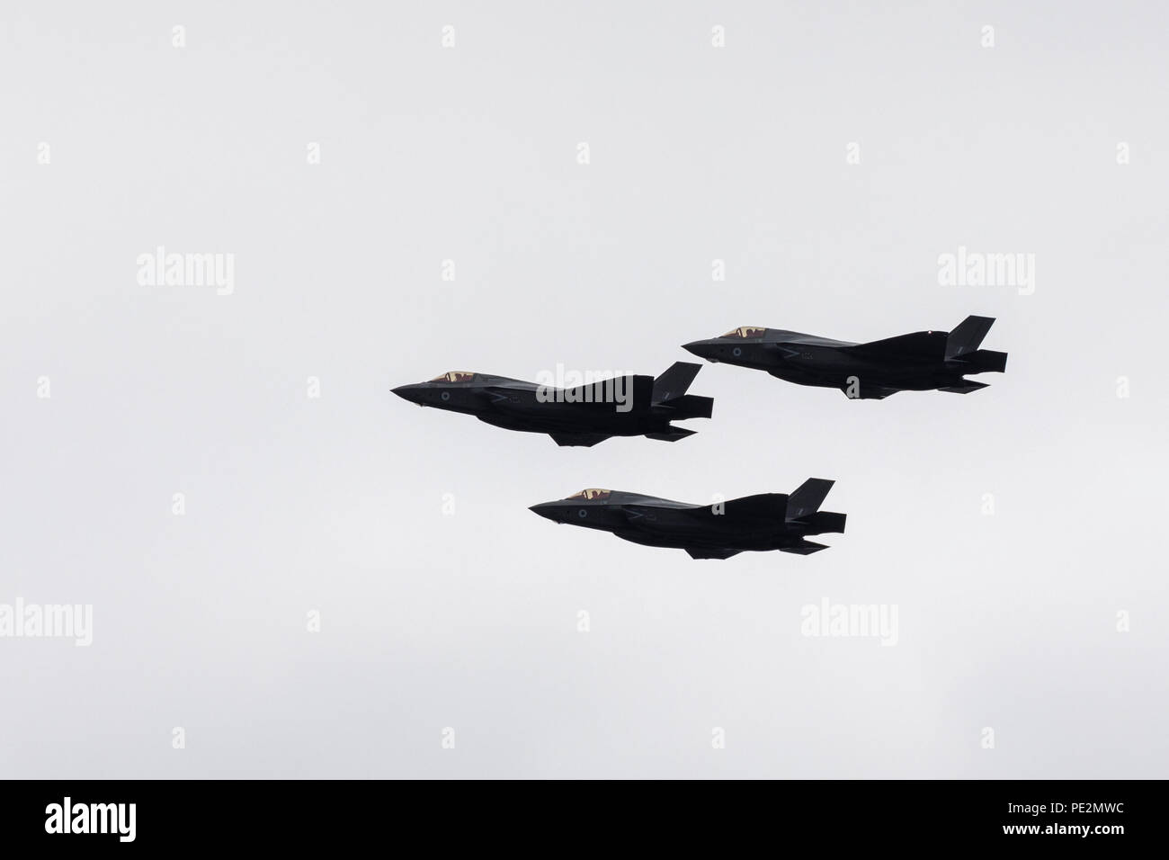 Three Lockheed Martin F-35 Lightning II fighter jets passing overhead in formation for the RAF100 London flypast Stock Photo