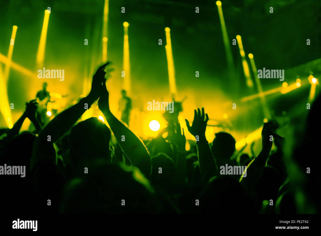 applause, crowd of people applauding to musicians at music festival, silhouettes of clapping hands at concert show Stock Photo