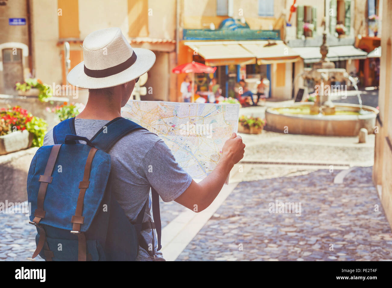 traveling people, tourist looking at map on the street in France, Europe Stock Photo