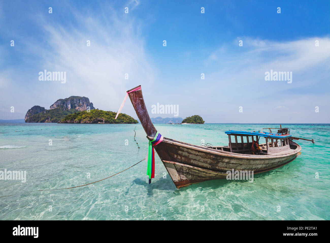 beautiful island beach landscape in Thailand between Krabi and Phuket, travel by traditional wooden longtail boat in paradise turquoise water Stock Photo