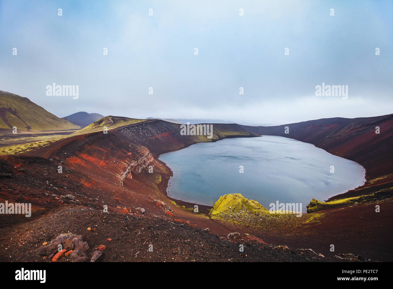 moon landscape with red crater in Iceland, Ljotipollur Lake in volcanic mountains of Landmannalaugar, beautiful scenic nature of highlands Stock Photo