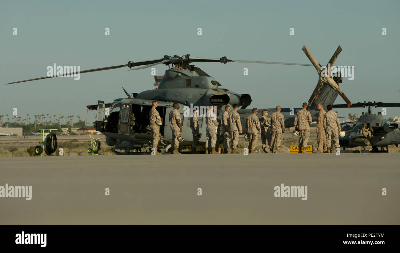 U.S. Marines with air ground support conduct an aircraft familiarization tour aboard Marine Corps Air Station Yuma, Ariz., on Sept. 23, 2015. This  tour is a part of WTI 1-16, a seven week training event, hosted by Marine Aviation Weapons and Tactics Squadron One (MAWTS-1) cadre, which emphasizes operational integration of the six functions of Marine Corps aviation in support of a Marine Air Ground Task Force. MAWTS-1 provides standardized advanced tactical training and certification of unit instructor qualifications to support Marine Aviation Training and Readiness and assists in developing a Stock Photo