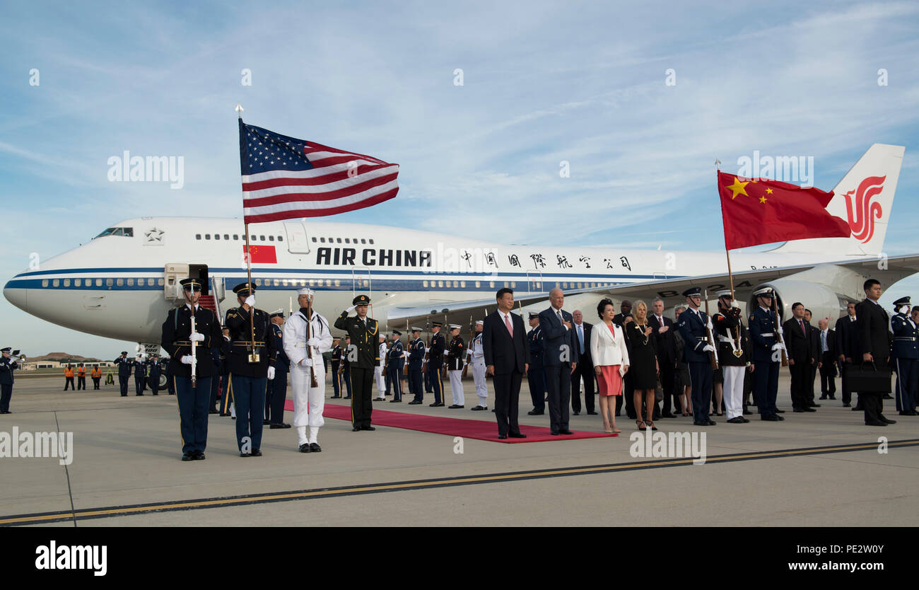President of China Xi Jinping and Vice President Joe Biden stand during the playing of the United States national anthem on the Joint Base Andrews, Md., flightline Sept. 24, 2015. Xi flew into the Washington, D.C., area to meet with U.S. executives for a state visit. (U.S. Air Force photo by Airman 1st Class Philip Bryant/Released) Stock Photo
