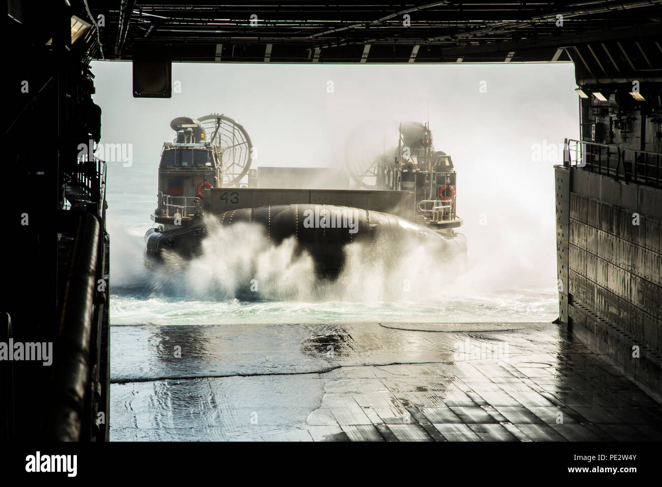 A Landing Craft Air Cushion (LCAC) boards the USS NEW ORLEANS to load ...