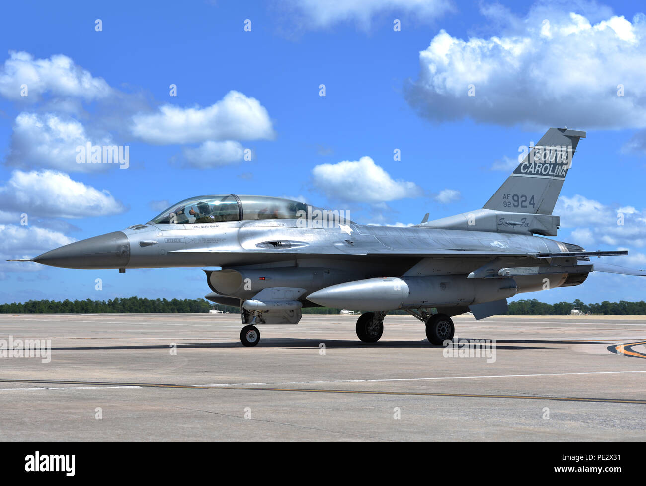 An F-16 Fighting Falcon from the South Carolina Air National Guard's 169th Fighter Wing returns with Senior Airman Shrutit Patel, 33rd Maintenance Group maintenance analyst, after an incentive flight at Eglin Air Force Base, Fla., Sept. 17, 2015. The 169th FW guardsmen spent two weeks conducting fifth generation integration training with 58th Fighter Squadron pilots. (U.S. Air Force Photo/Senior Airman Andrea Posey) Stock Photo