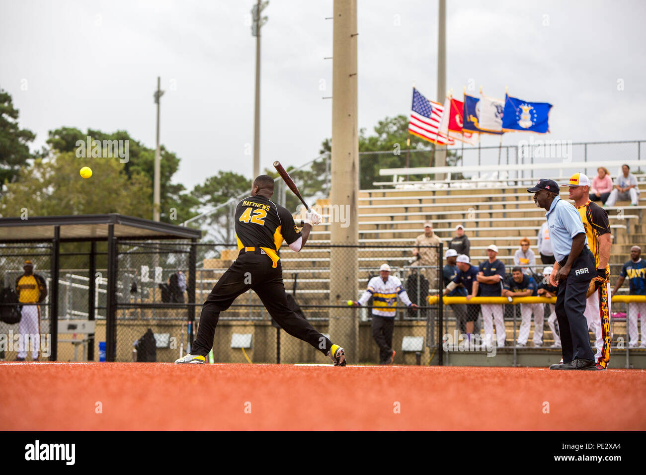 U.S. Army Spc. Jedon Matthews, an infielder for the U.S. Army men's softball team, prepares to swing during the 2015 Armed Forces Softball Tournament at the Harry Agganis Softball Field on Camp Lejeune, N.C., Sept. 24, 2015. 160 athletes representing the U.S. Army, Marine Corps, Navy, and Air Force competed during a weeklong softball tournament hosted by Marine Corps Community Services. (U.S. Marine Corps photo by Sgt. Christopher Q. Stone, MCIEAST-MCB CAMLEJ Combat Camera/Released) Stock Photo