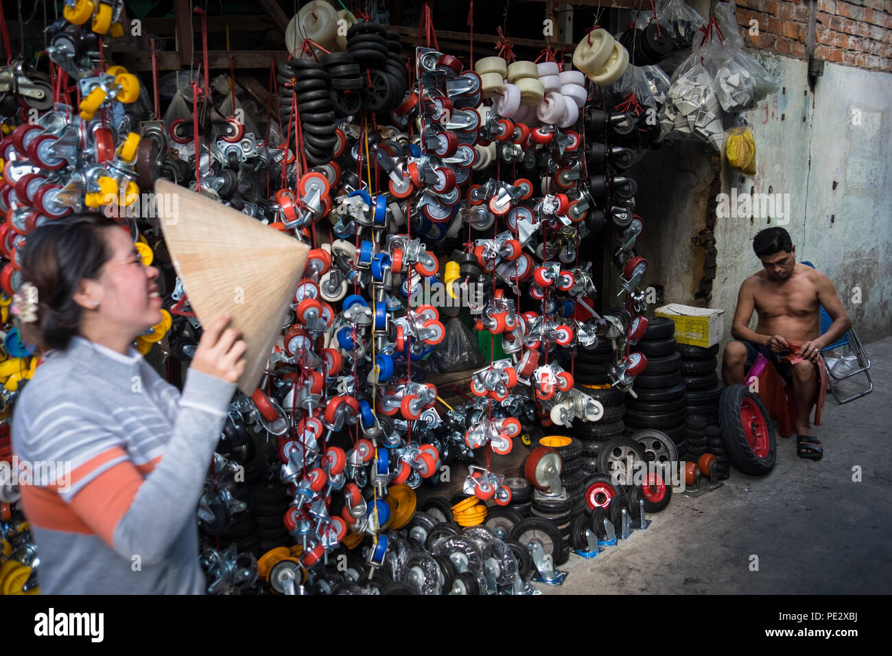 A man selling castor wheels in Cho An Lac Market, Can Tho, Vietnam Stock Photo