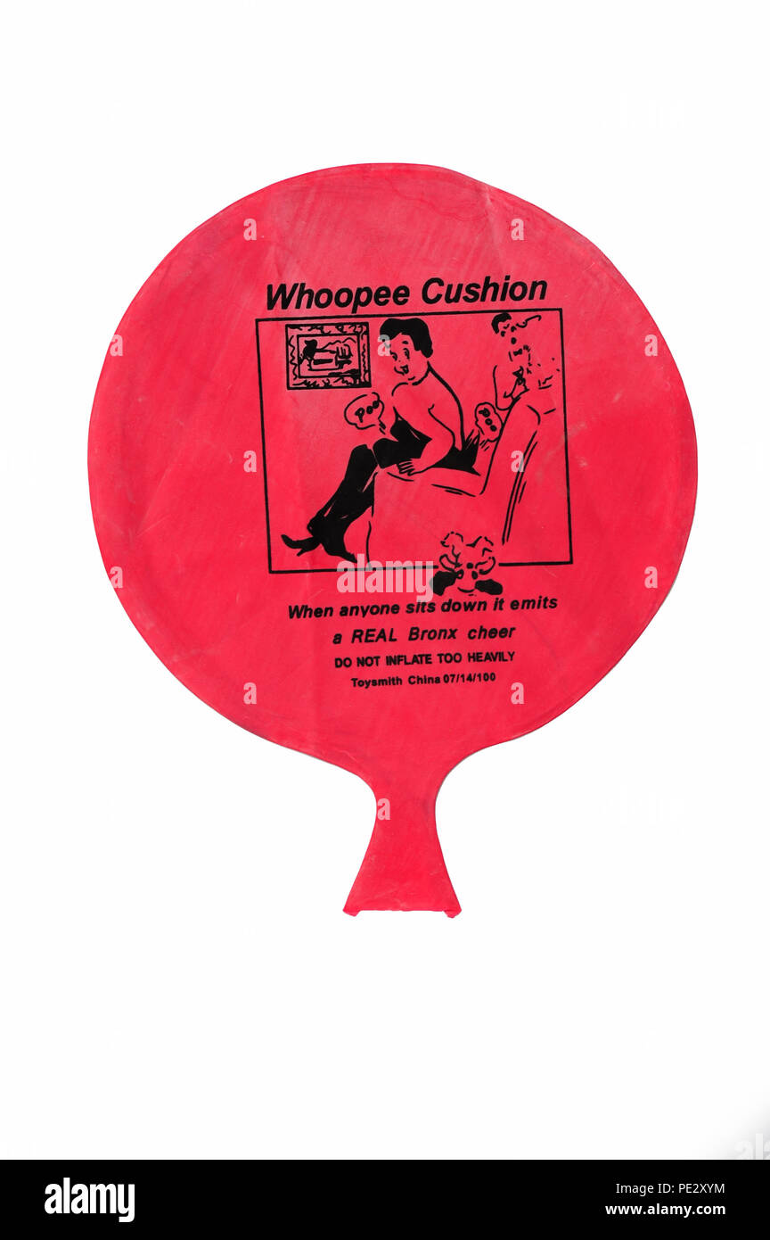 a red novelty Whoopee Cushion made for gags and tricks for fake fart noises Stock Photo