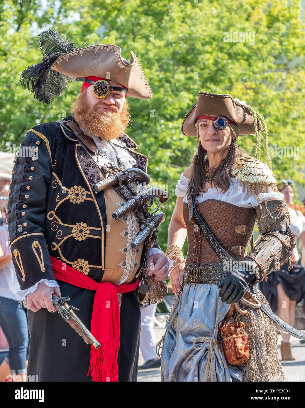 A couple in pirate costumes pose for a portrait at the annual Coldwater Steampunk Festival, Stock Photo