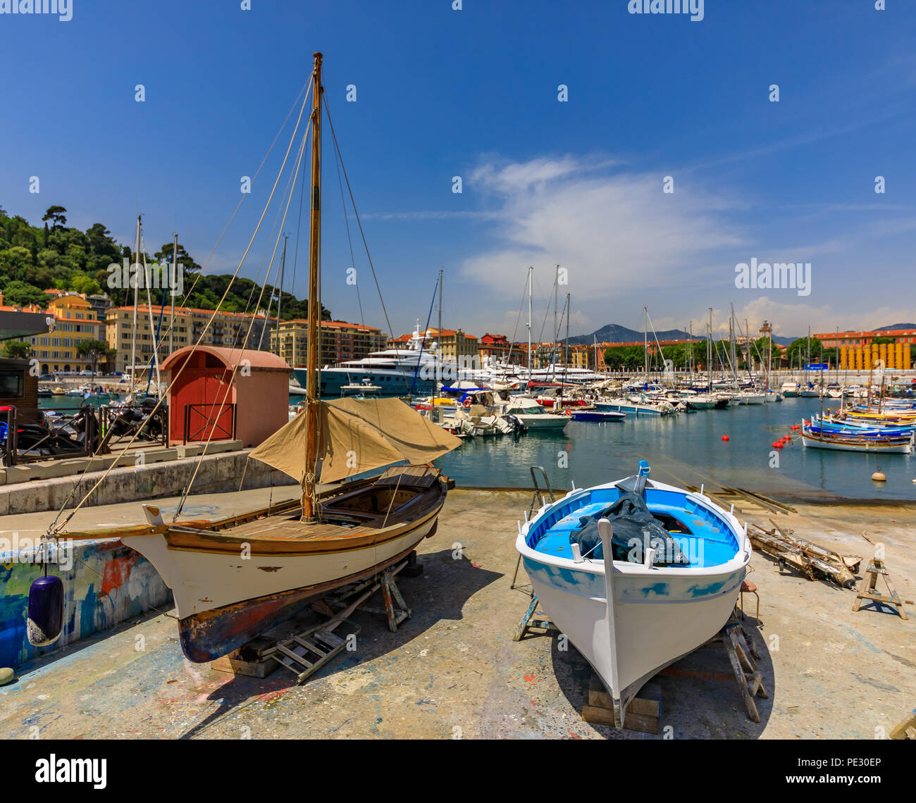 Old classic wooden boats on shore for repairs in Lympia port of Nice, Côte d'Azur, France Stock Photo