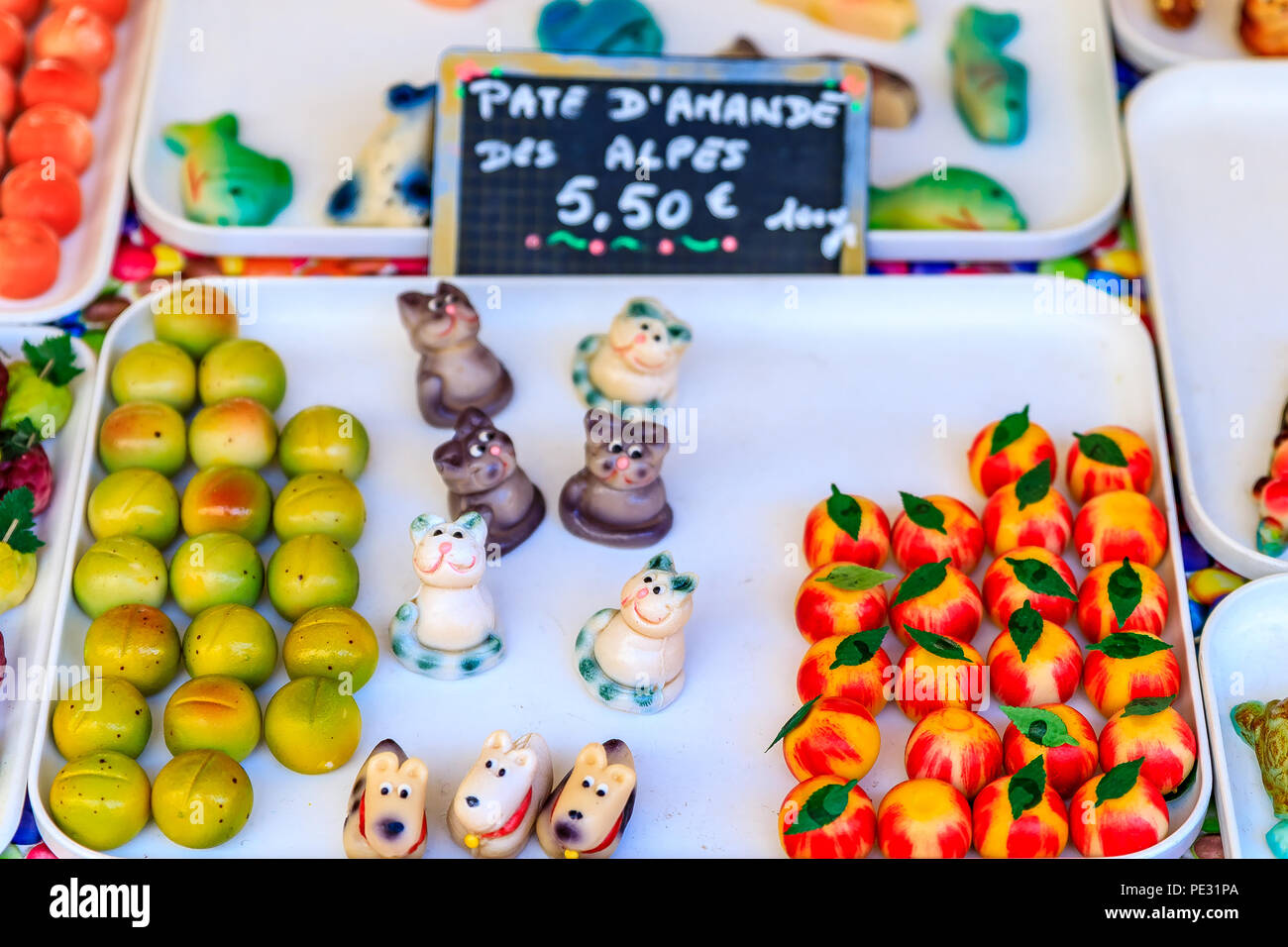 Colorful marzipan or almond paste candy made to look like fruits and vegetables and a market in Nice, France. Stock Photo