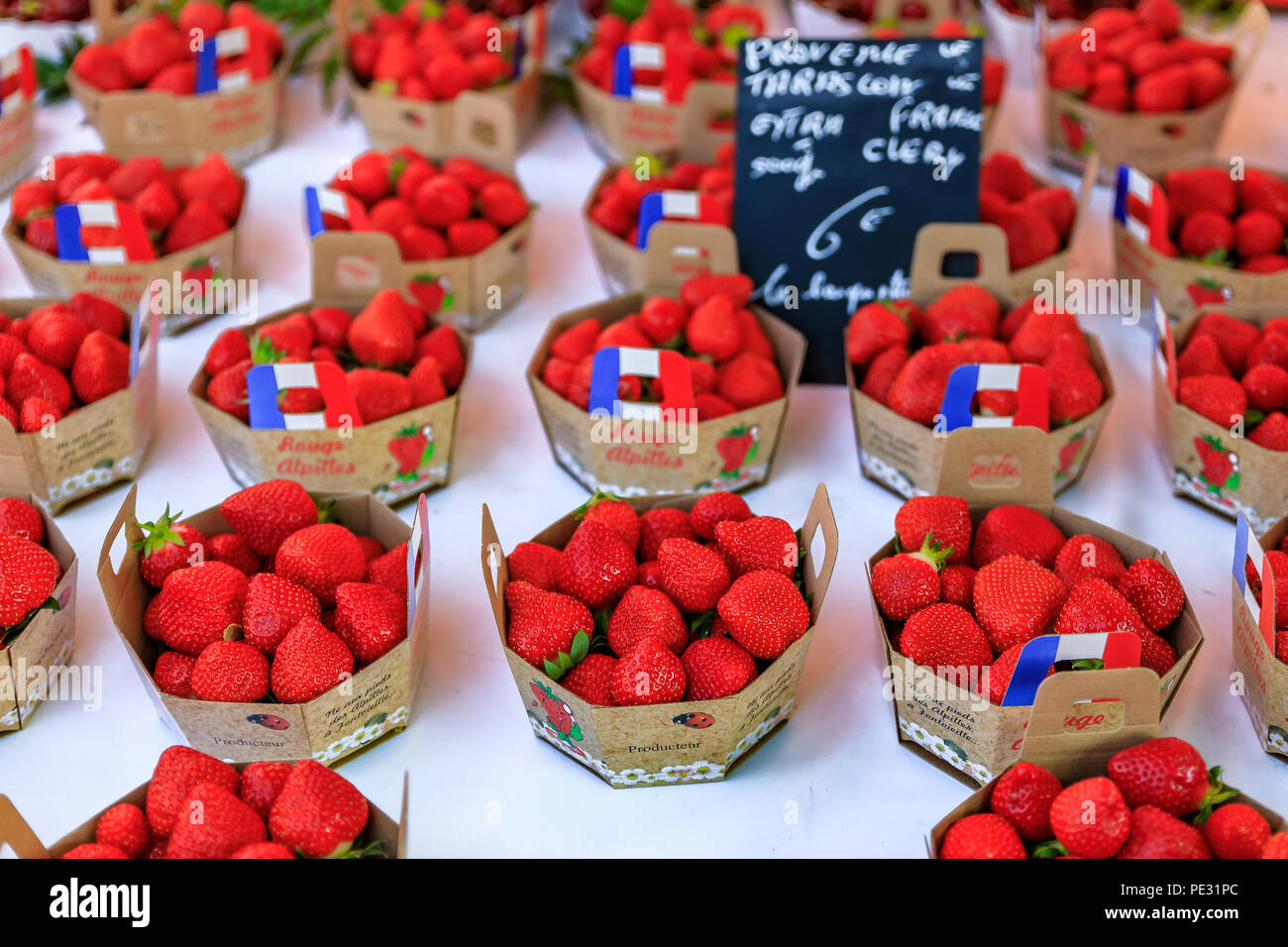 Nice, France - May 26, 2017: Ripe red strawberries at a local outdoor farmers market in Nice, France Stock Photo
