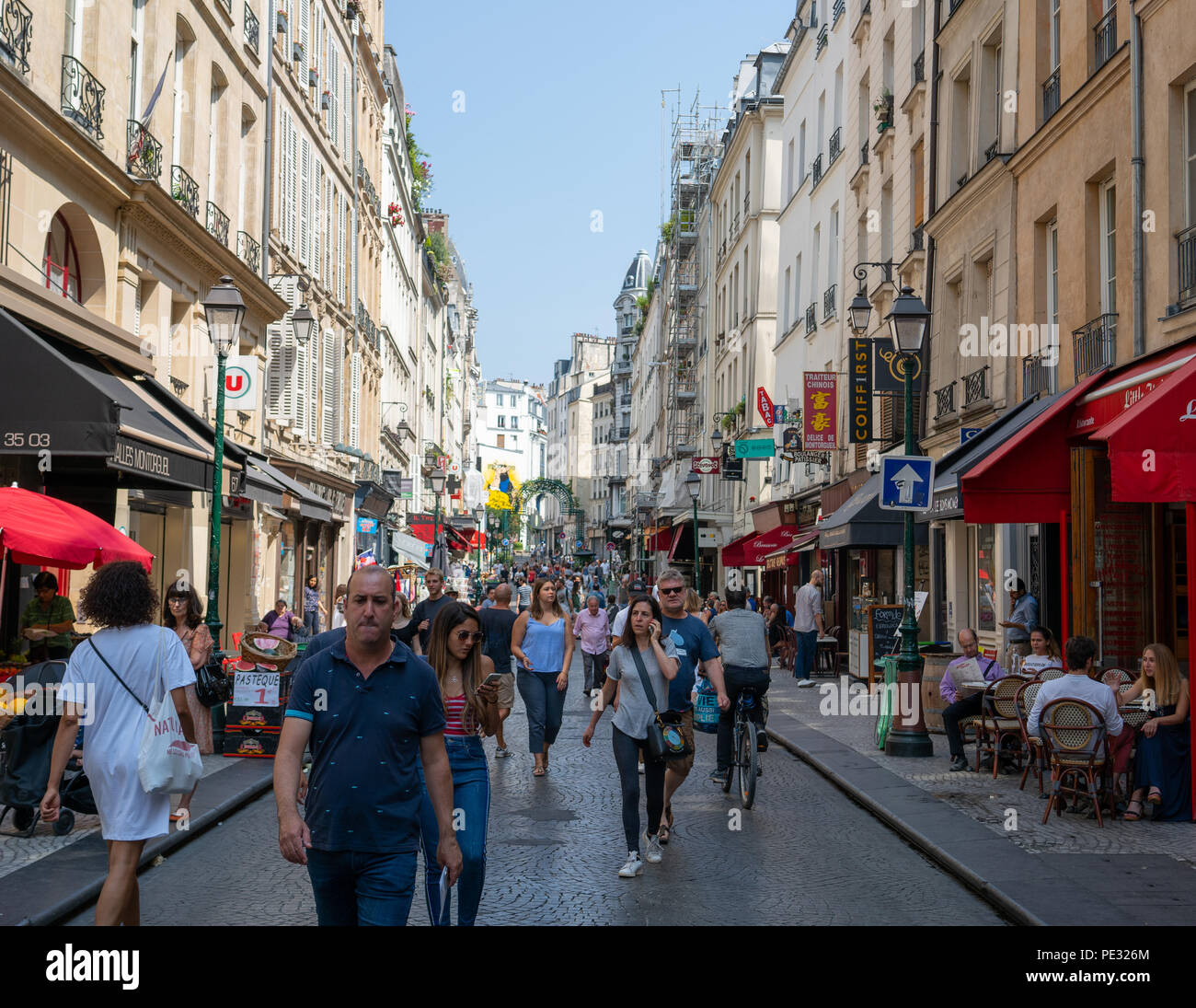 Paris France, 14 July 2018: Rue Montorgueil pedestrian street view in Paris France during summer with tourists and parisian people Stock Photo