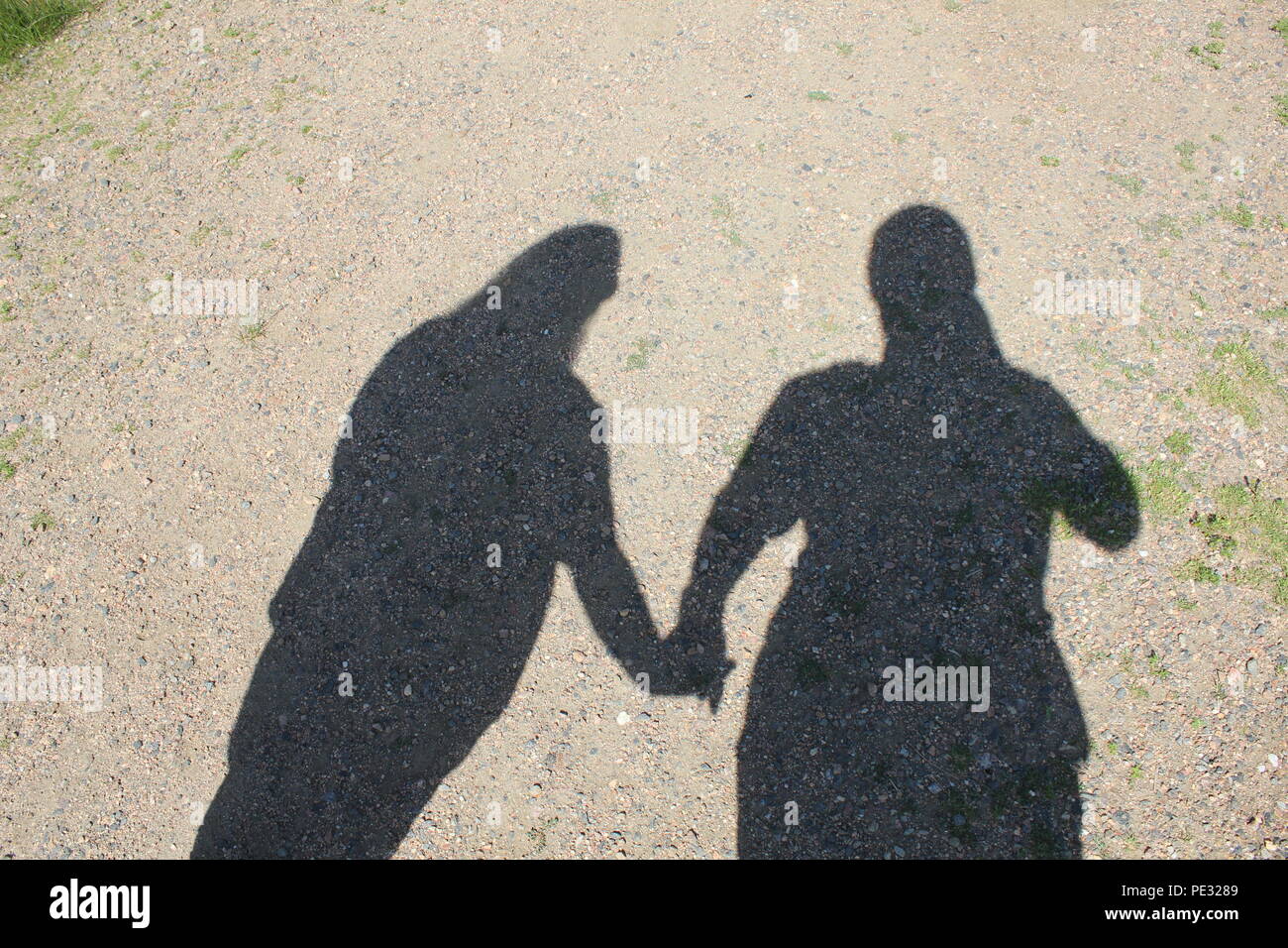 Shadow couple holding hands hires stock photography and images Alamy