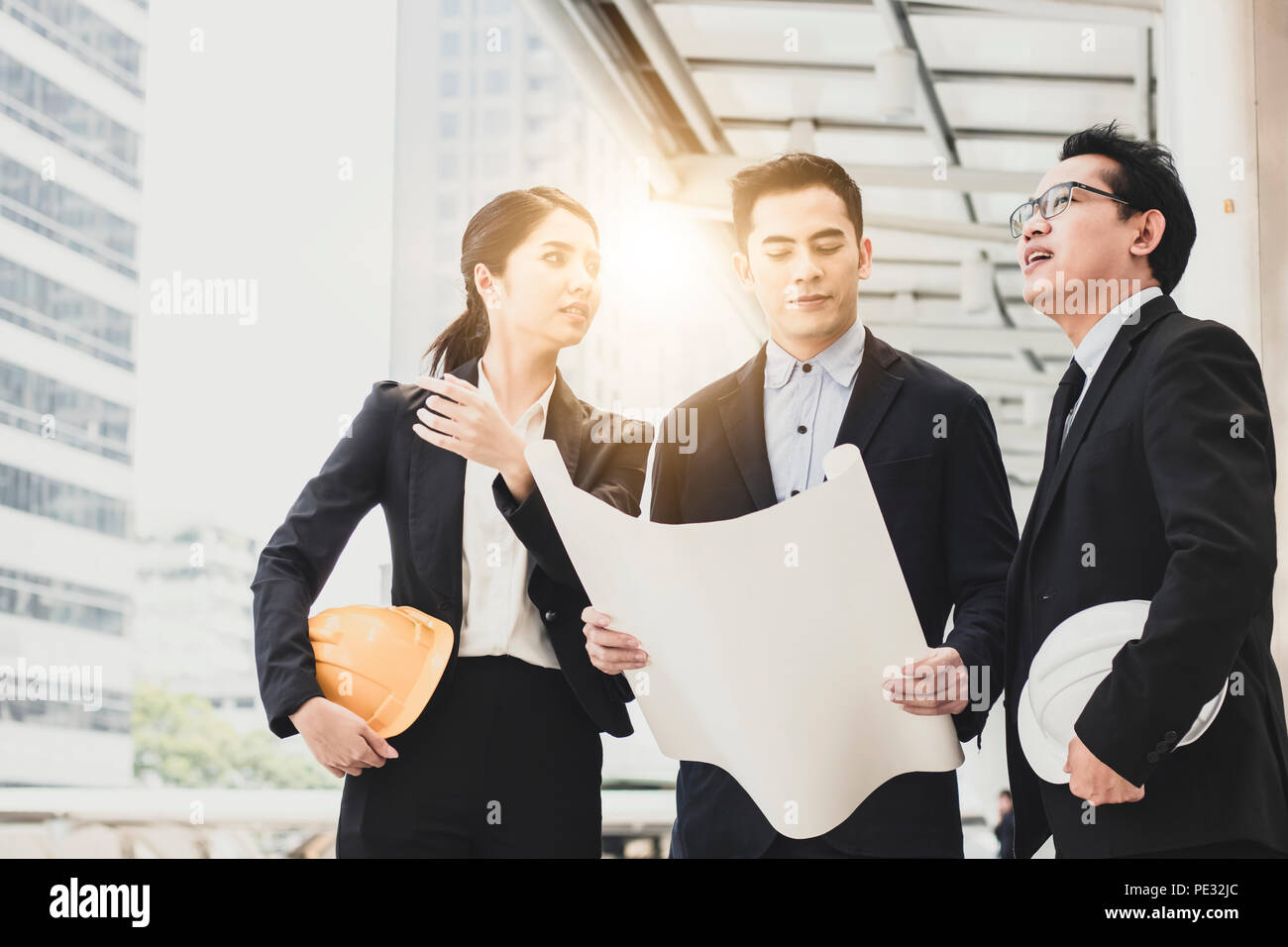 Architecture and engineer explaining project with investor holed