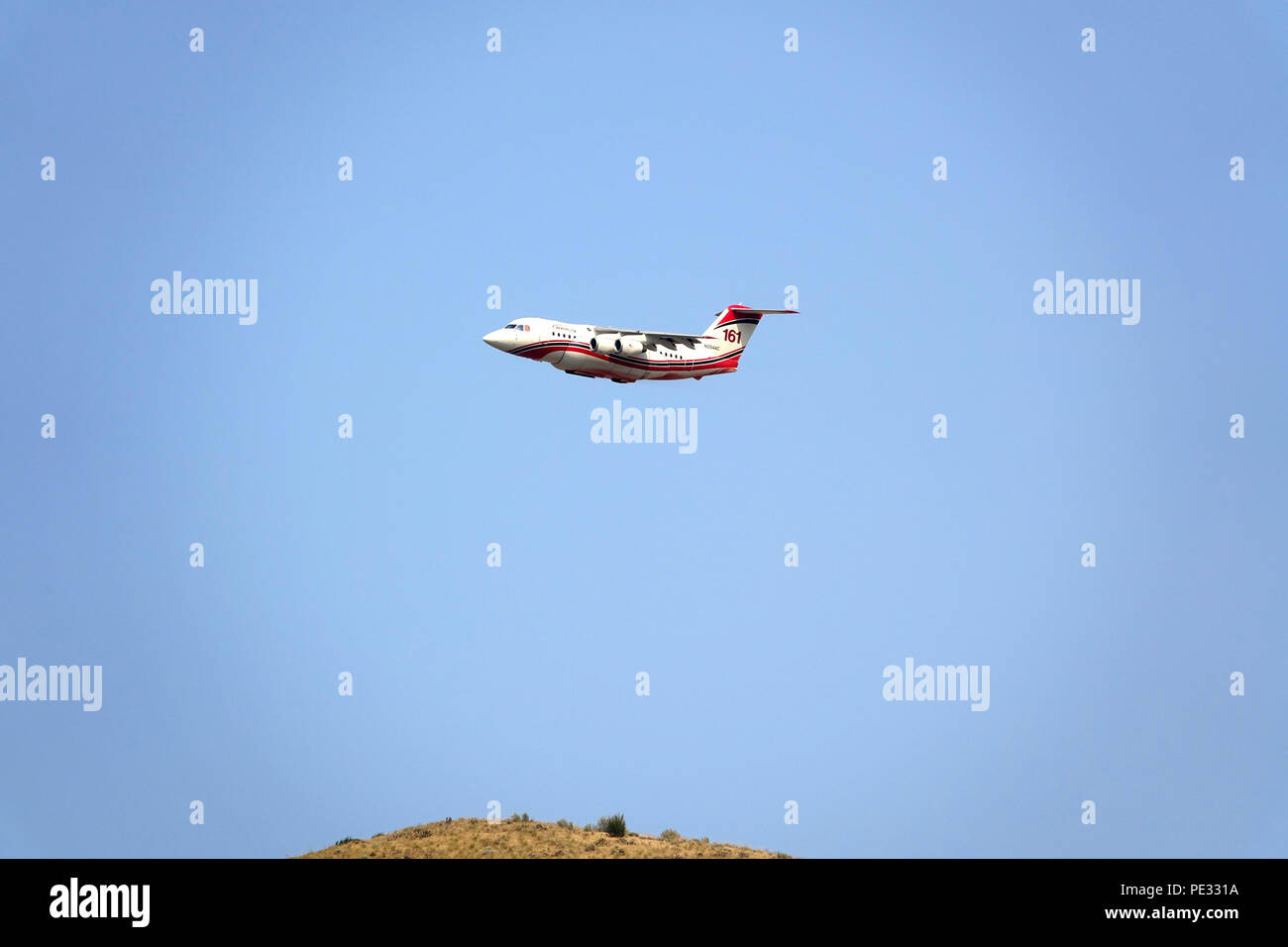 Neptune Company's AeroFlite RJ85 airtanker helped suppress a wildfire in North Central Washington in July 2018. Stock Photo