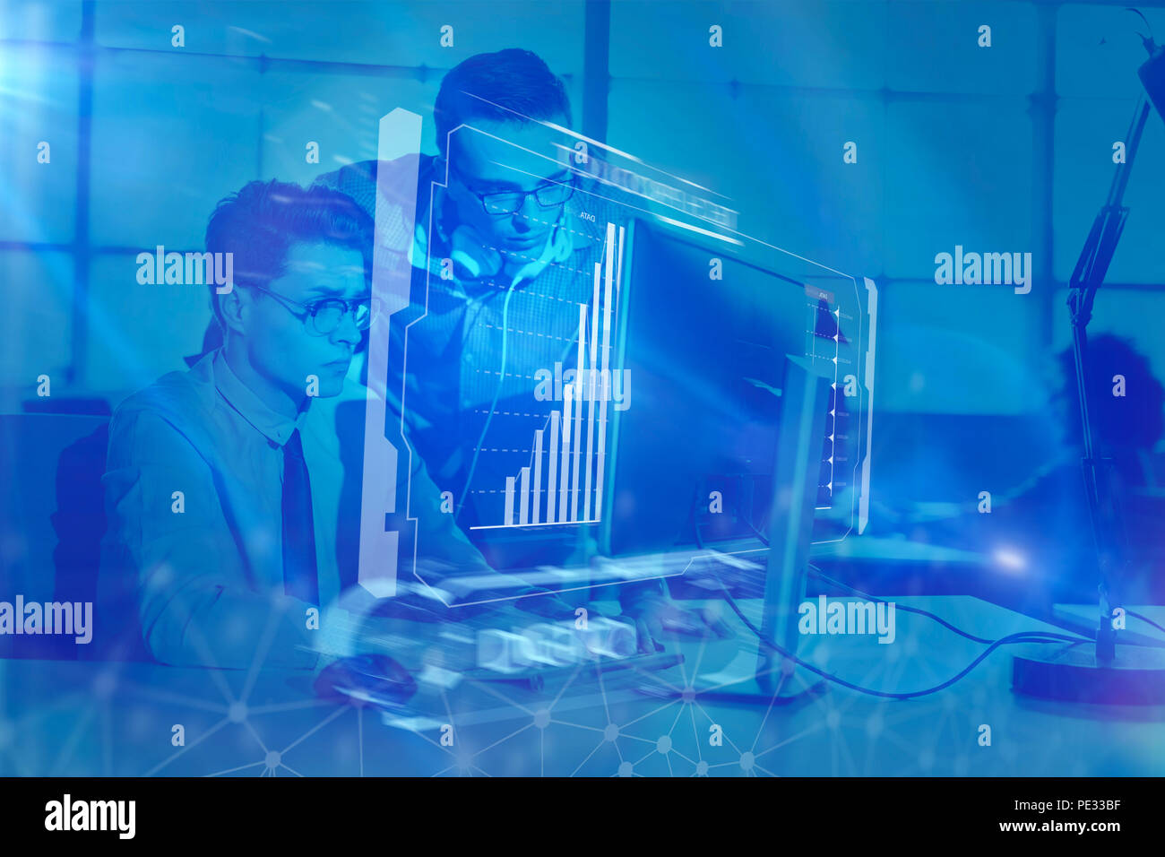 two business people using computer preparing for next meeting and ...