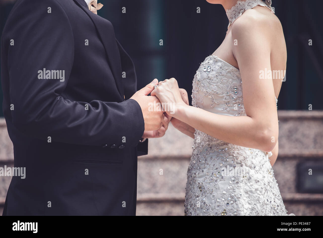 Wedding couple holding hands a symbol of love and marriage. Stock Photo