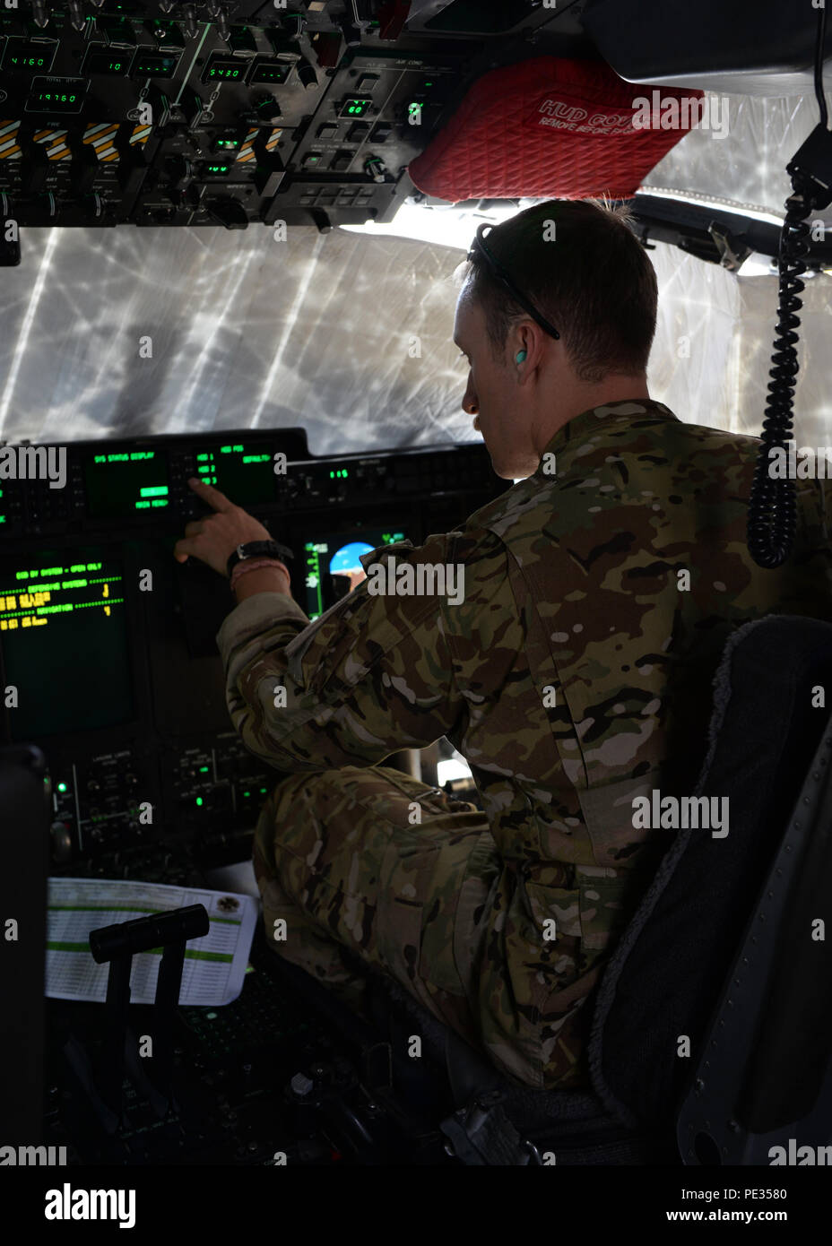 U.S. Air Force Capt. Matt Buchholtz, 774th Expeditionary Airlift Squadron C-130J Super Hercules pilot, turns on controls before getting ready for takeoff Sept. 3, 2015, at Bagram Air Field, Afghanistan. Buchholtz and his team, who are deployed from Little Rock Air Force Base, Ark., fly various combat missions throughout Afghanistan supporting missions ranging from medical evacuations to cargo and passenger transports. (U.S. Air Force photo by Senior Airman Cierra Presentado/Released) Stock Photo