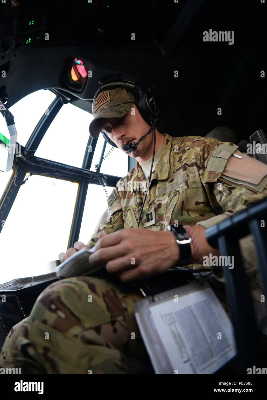 U.S. Air Force Capt. Matt Buchholtz, 774th Expeditionary Airlift Squadron C-130J Super Hercules pilot, turns on controls in preparation for takeoff Sept. 3, 2015, at Al Udeid Air Base, Qatar. Buchholtz and his team, who are deployed from Little Rock Air Force Base, Ark., fly various combat missions throughout Afghanistan supporting missions ranging from medical evacuations to cargo and passenger transports. (U.S. Air Force photo by Senior Airman Cierra Presentado/Released) Stock Photo