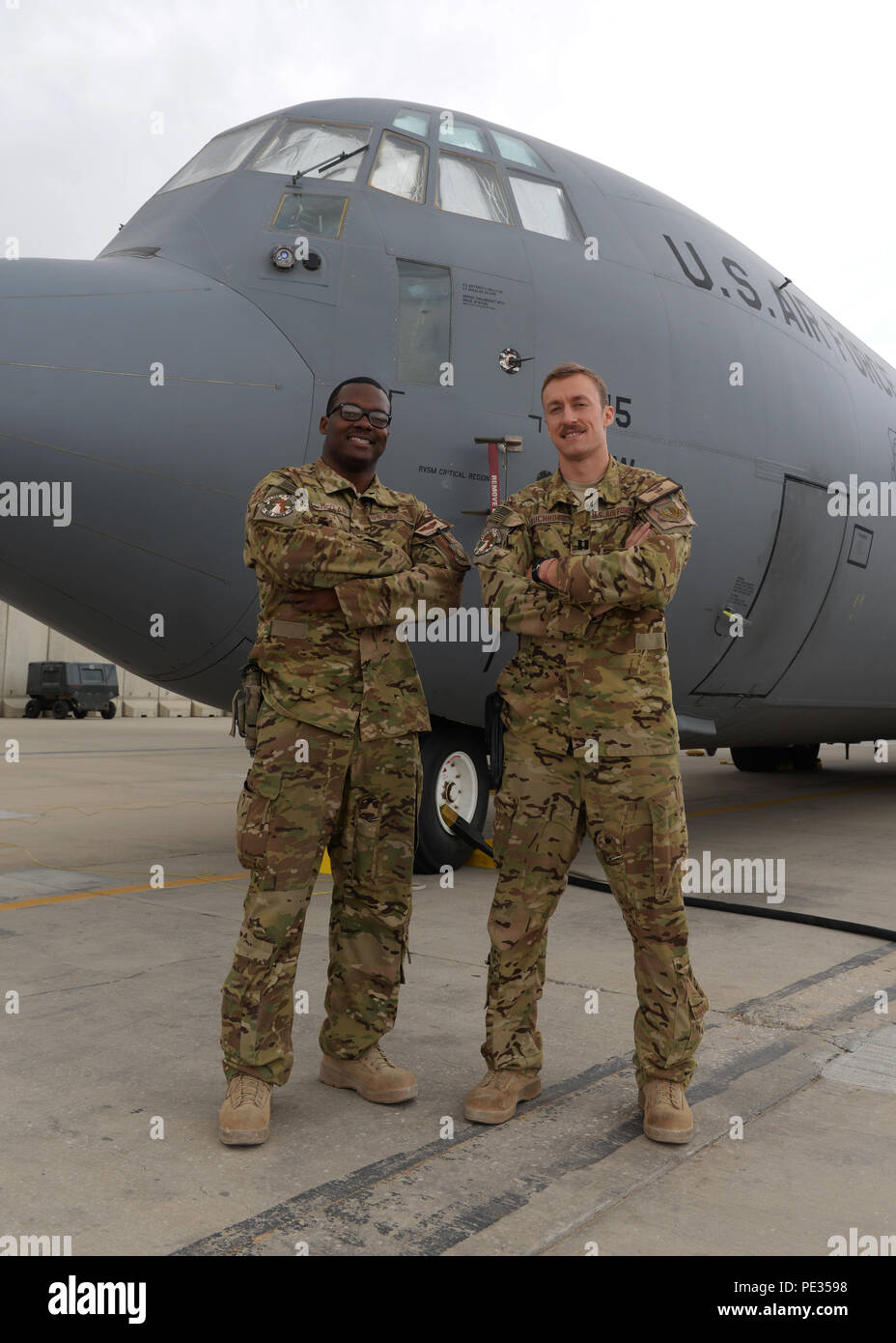 U.S. Air Force Capt.’s Boston McClain and Matt Buchholtz, 774th Expeditionary Airlift Squadron C-130J Super Hercules pilots, pose for a photo Sep. 4, 2015, at Bagram Air Field, Afghanistan. The pilots are responsible for transporting mission essential assets as well as passengers to various forward operating bases throughout Afghanistan. (U.S. Air Force photo by Senior Airman Cierra Presentado/Released) Stock Photo