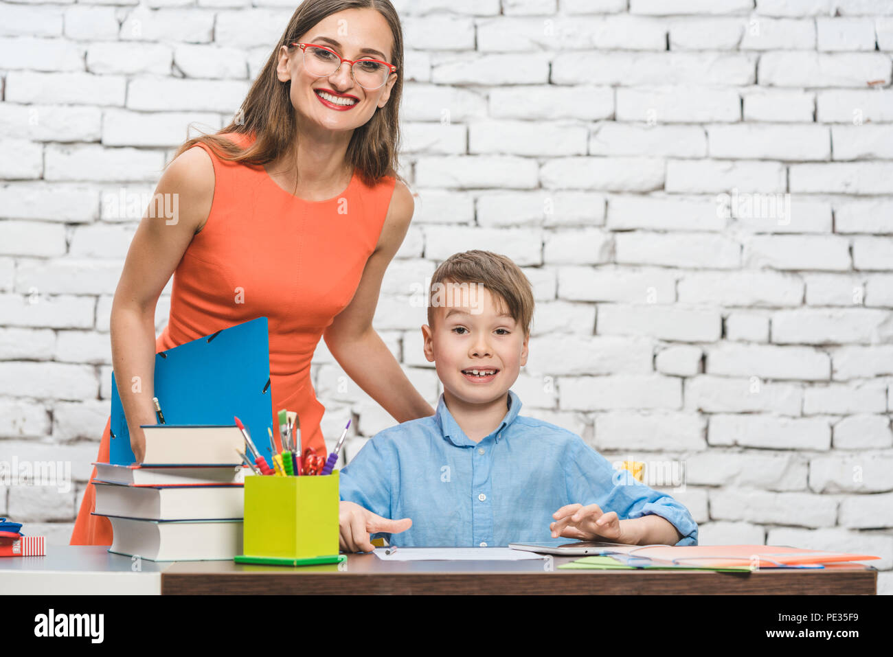 Teacher and school student looking at the camera Stock Photo