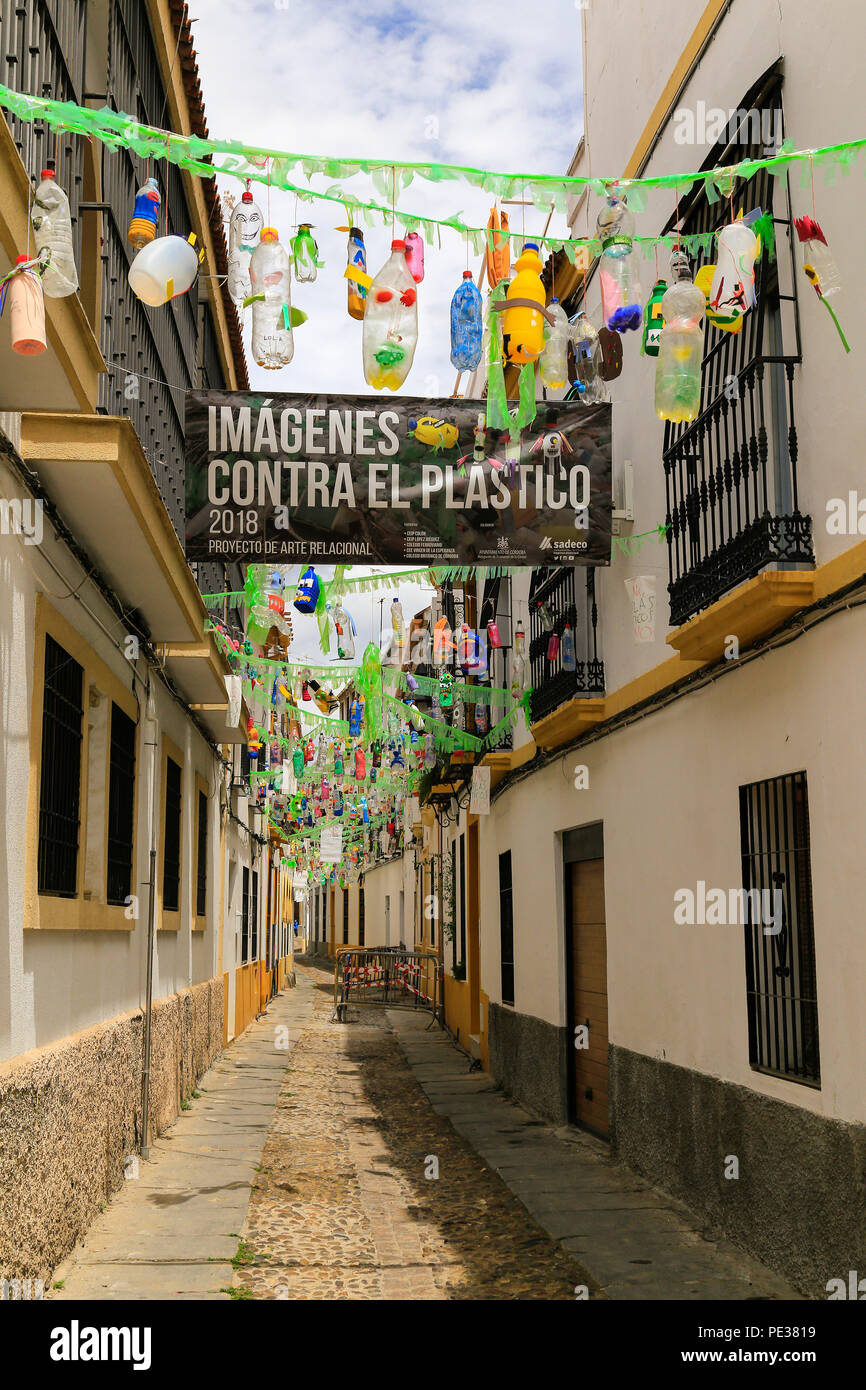 Anti plastic demonstration of bottles hanging in the back streets of Cordoba, Spain. Imagenes contra plasticos. Stock Photo