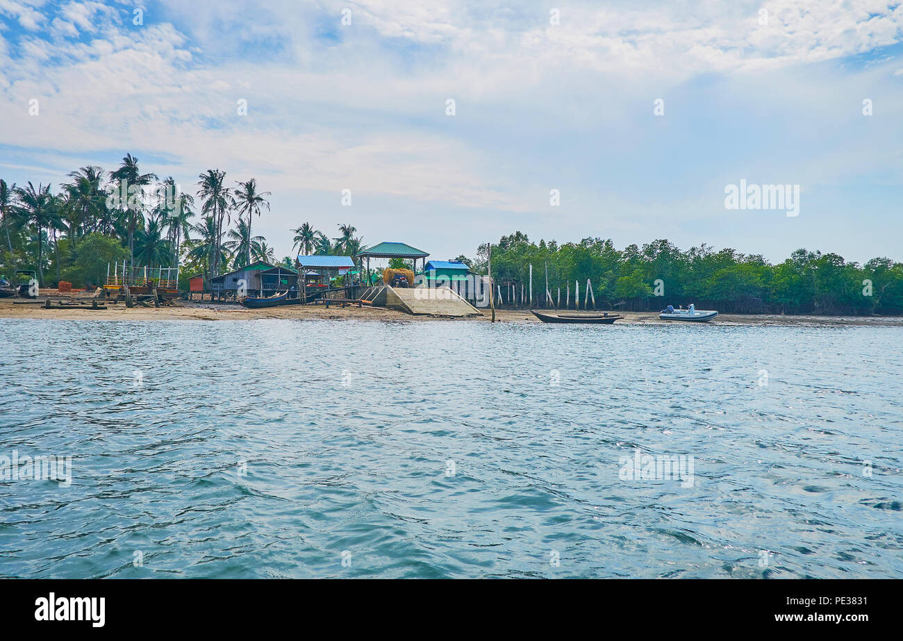 The ferry pier of Kangyi village on the bank of Kangy river at the low ...