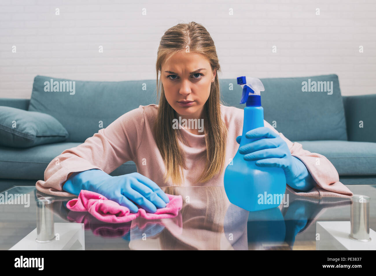 Angry tired housewife cleaning hi-res stock photography and images - Alamy