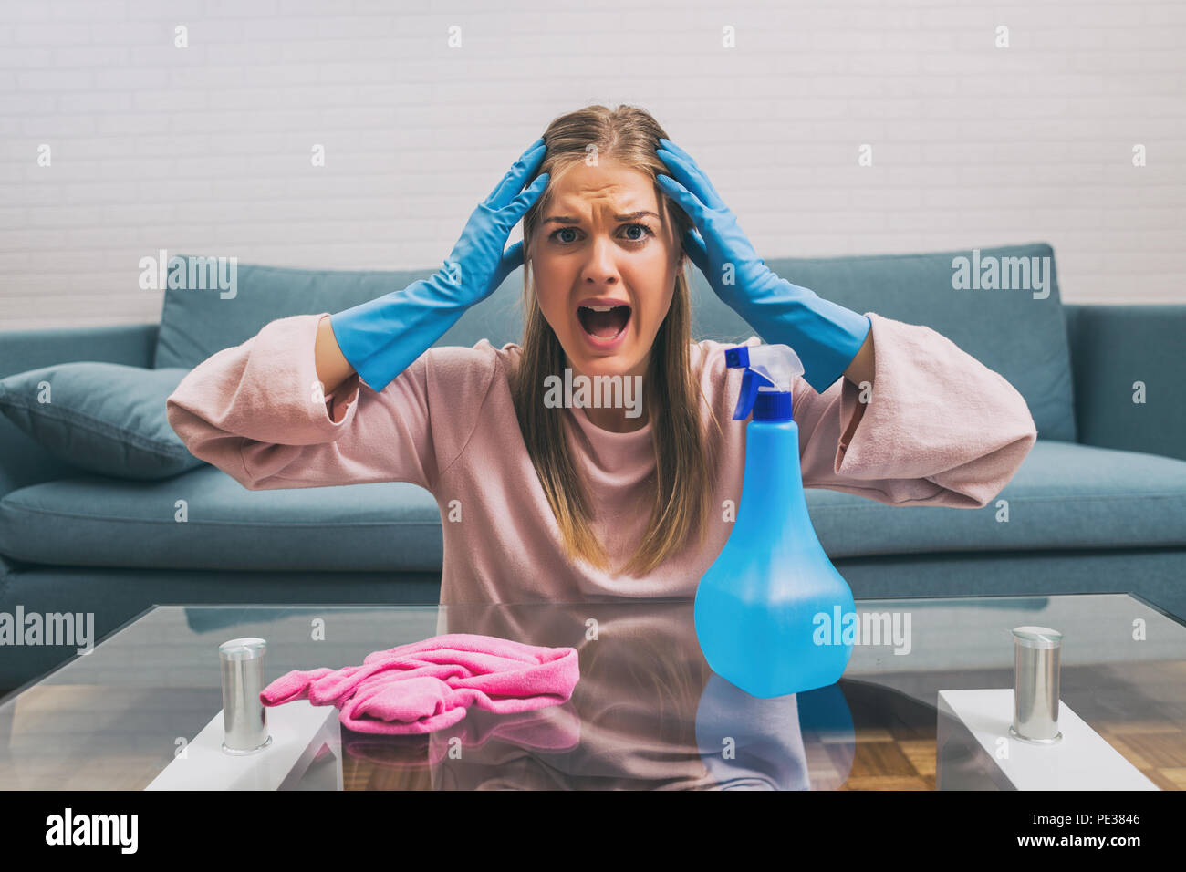 Angry housewife screaming because she is tired of cleaning and ...
