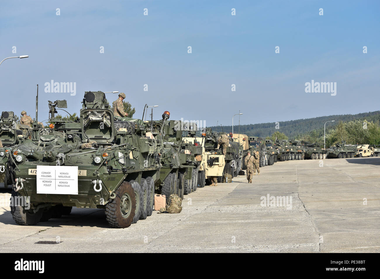 Troopers assigned to 4th Squadron, 2nd Cavalry Regiment, begin to stage their vehicles as the prepare to conduct preventive maintenance, checks and services before driving the second leg of the Dragoon Crossing, a tactical road march starting out at Rose Barracks, Germany and continuing through the Czech Republic and the Slovak Republic ending in Hungary on Sept. 14, 2015. The purpose of the exercise is to reassure NATO Allies of the U.S. intent during Operation Atlantic Resolve while demonstrating interoperability and freedom of movement throughout Eastern Europe. (U.S. Army photo by Sgt. Wil Stock Photo