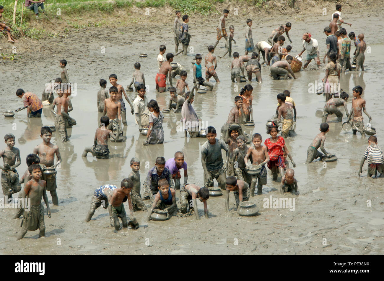 Gopalganj, Bangladesh -March 26, 2009: Fishing in the drying up rivers, canals and water bodies during the winter season is a common feature in Bangla Stock Photo