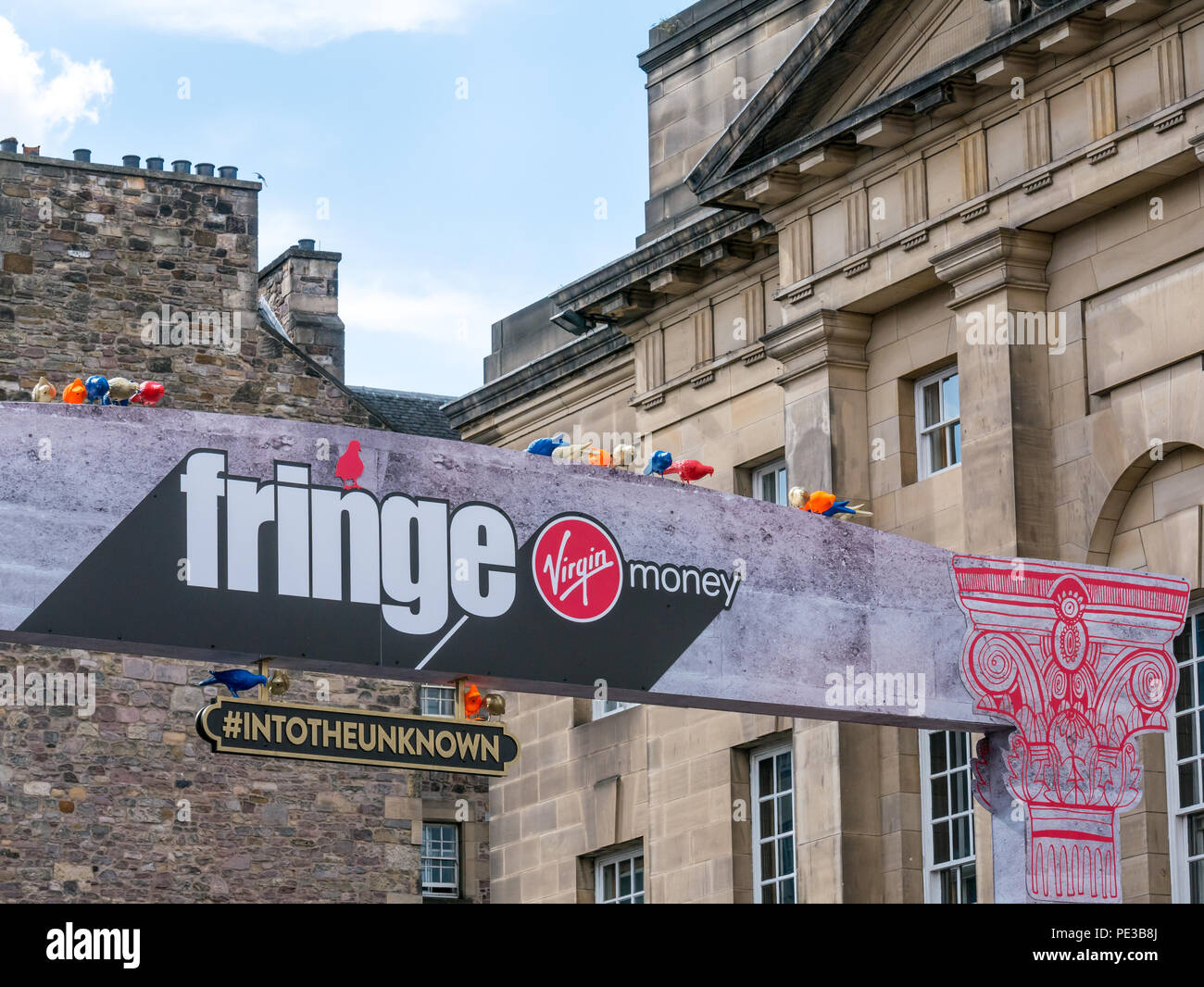 Venue entrance, street festival sponsored by Virgin Money in Edinburgh Fringe festival, On the Mile, Edinburgh, Scotland, UK with slogan Into Unknown Stock Photo
